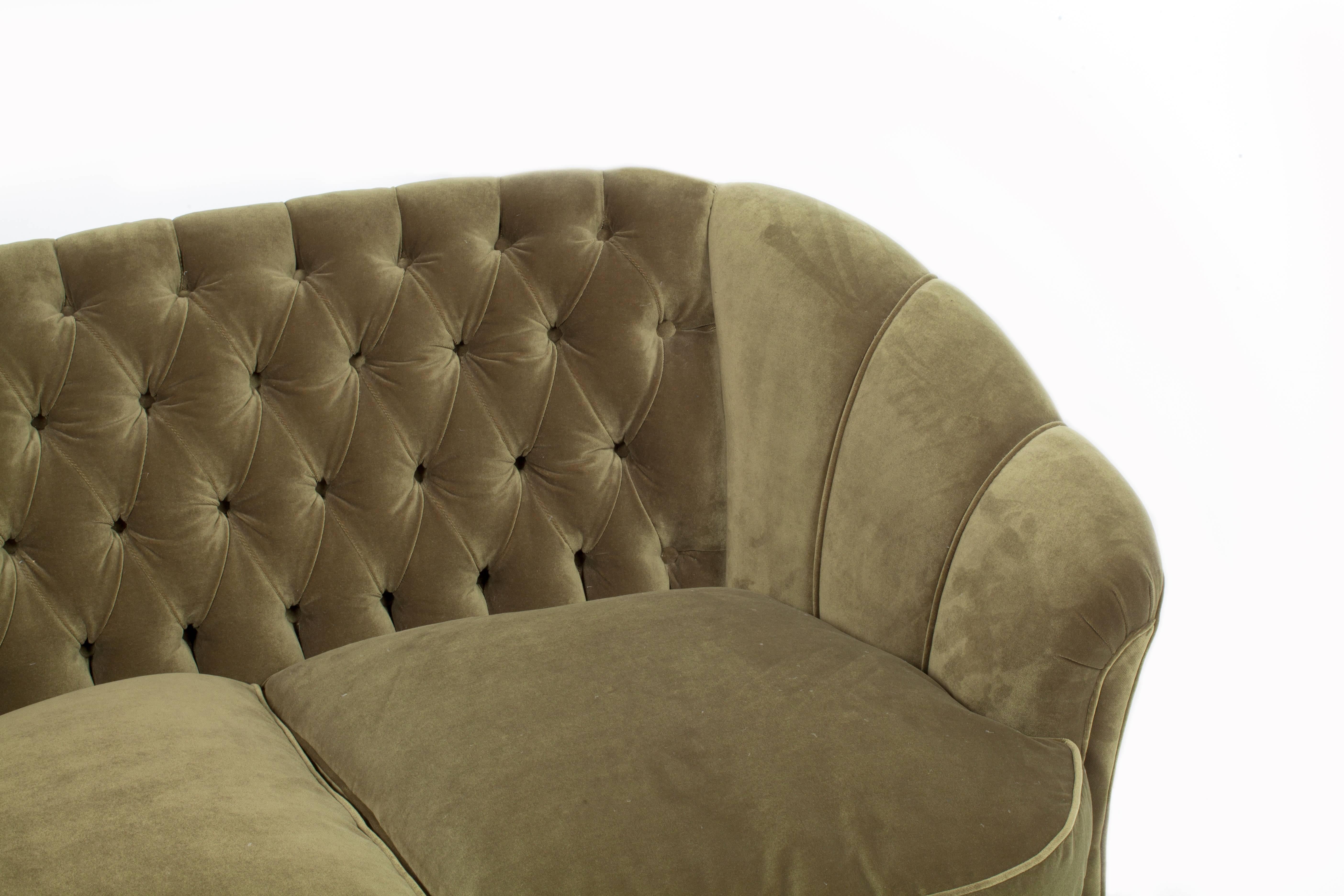 green velvet curved couch