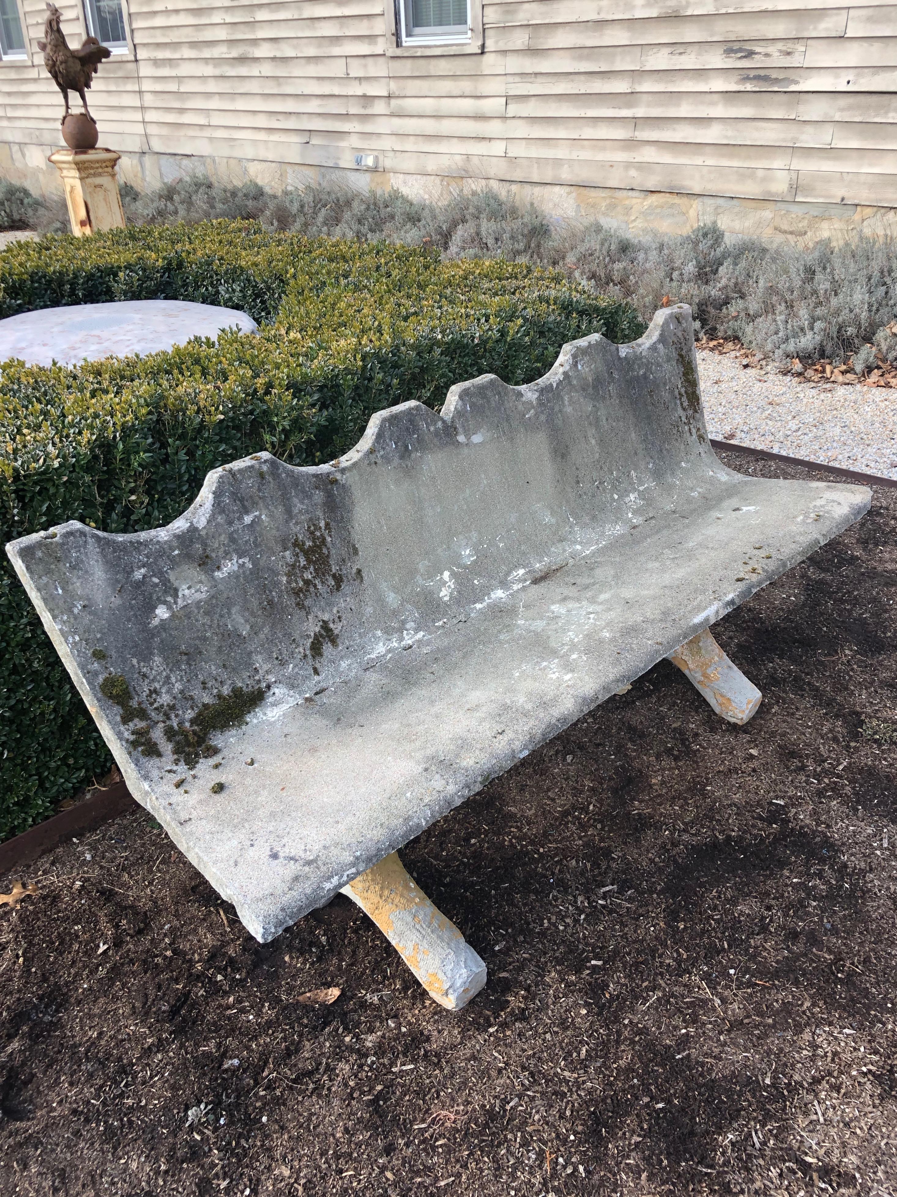 This bench has an unusual form and one that we have never seen before! Made of concrete with a scalloped top and faux bois feet retaining some of their original orange paint, this one will make an outstanding focal point in your garden. In very good