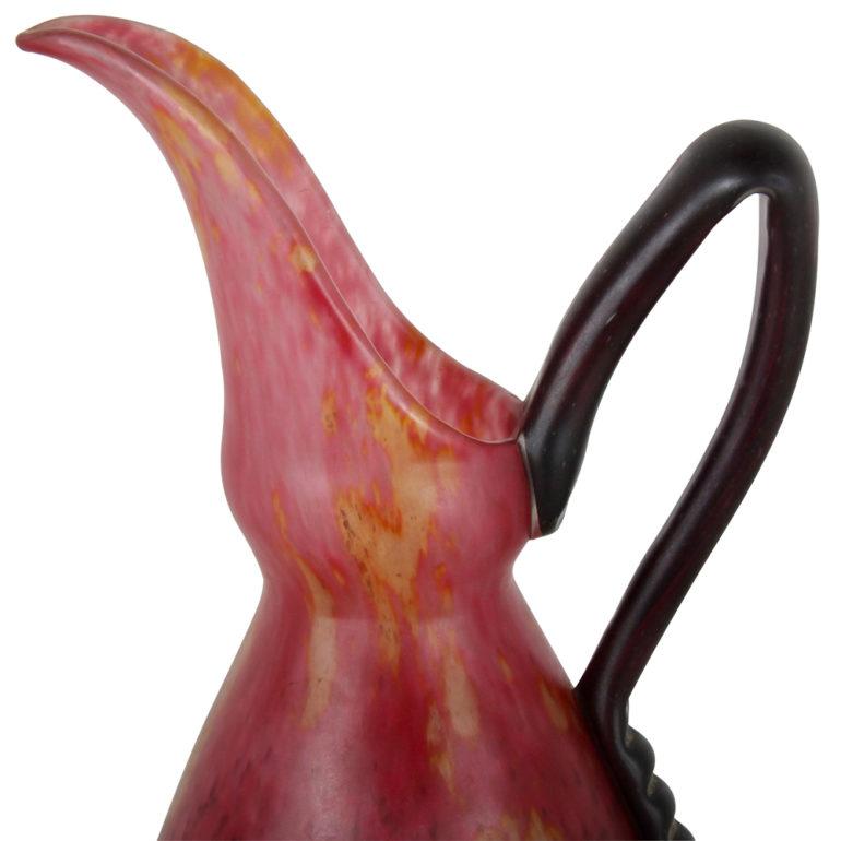 A French ‘Schneider’ art glass pitcher in mottled red and purple tones, circa 1920-1930. Signed.

The Schneider brothers recommissioned an old glassworks under the name Schneider Freres et Wolff (Schneider Brothers and Wolff), a few miles north of