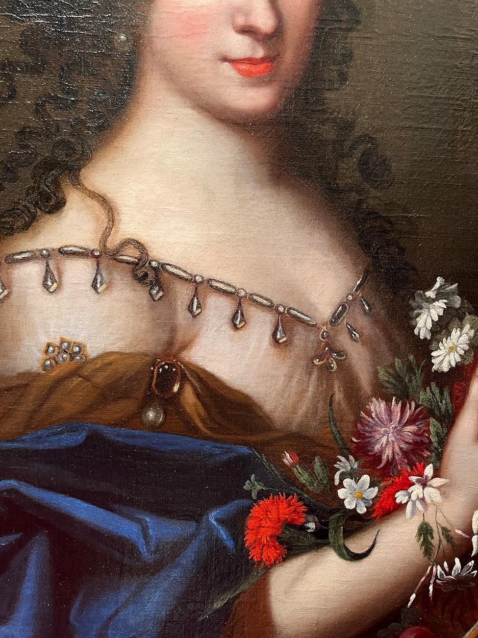 École française du XVIIe siècle Portrait de femme avec des fleurs Huile sur toile - Noir Portrait Painting par French School of the 17th Century 