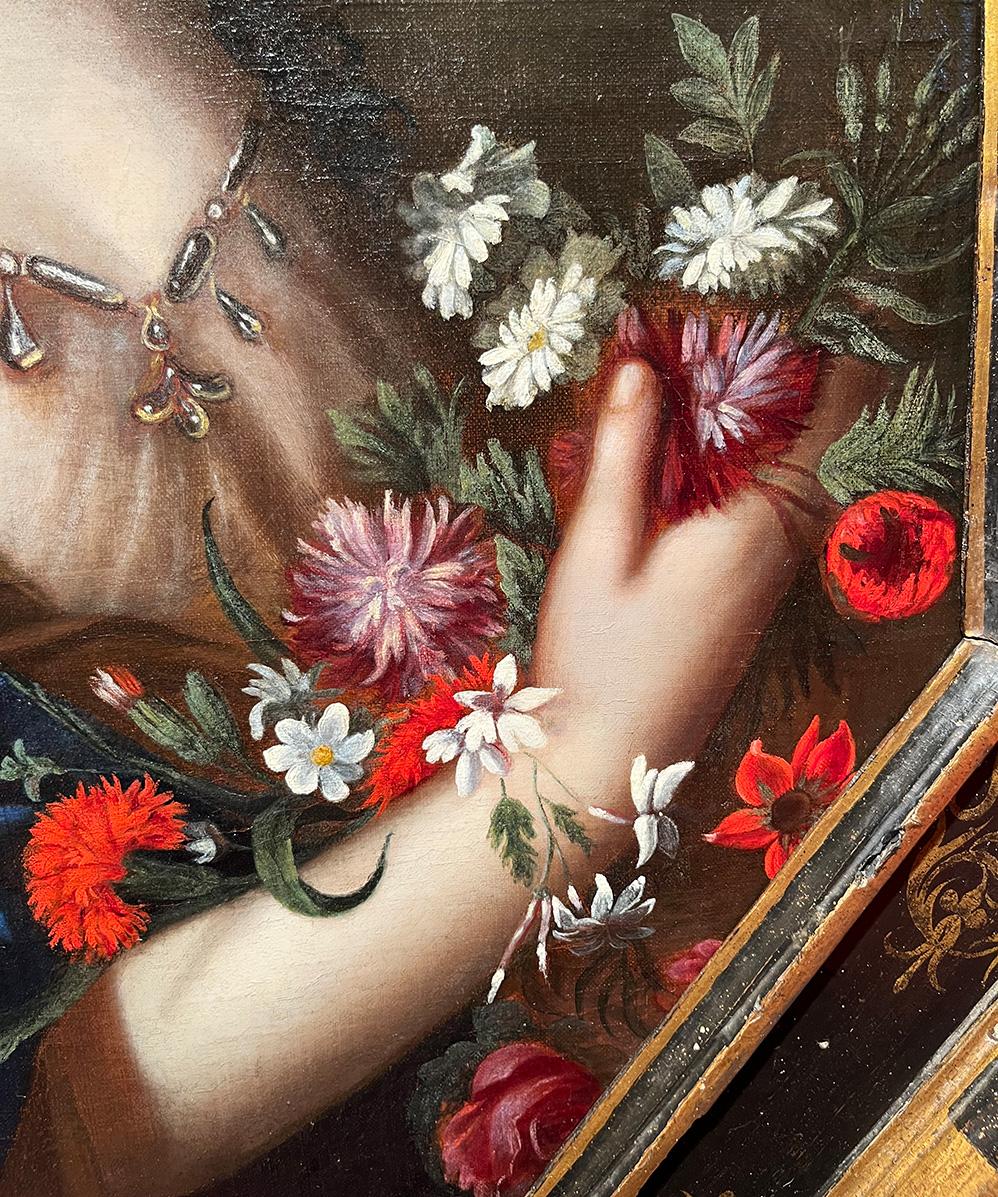 École française du XVIIe siècle - Cercle de Pierre Mignard (1612-1695) 
Titre : Portrait de femme avec des fleurs
Médium : Huile sur toile
Dimensions : sans cadre 81 × 68 cm - avec cadre 94,8 x 85,3 x 5 cm
Cadre octogonal avec décorations dorées
Non