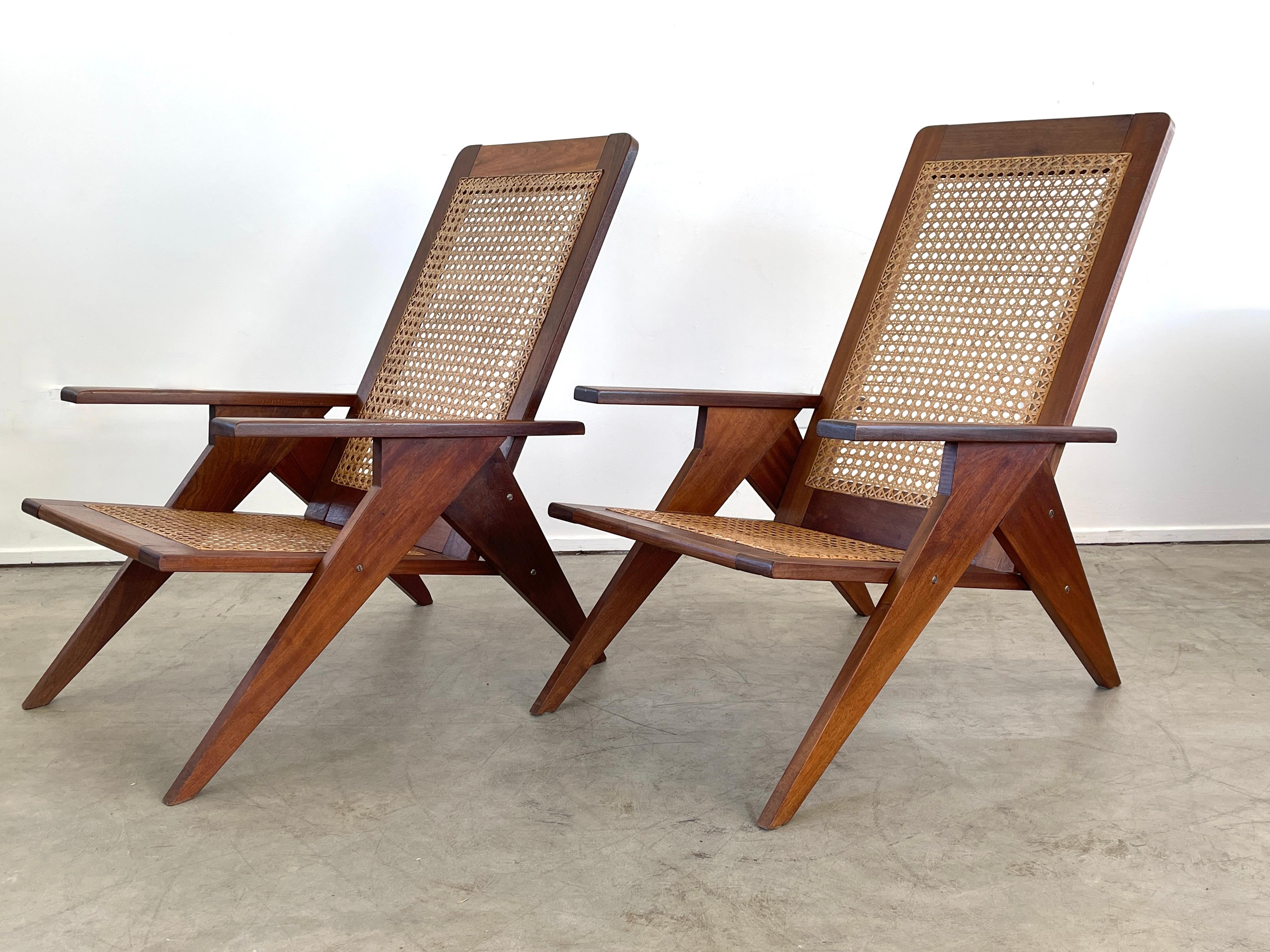 Wonderful pair of caned scissor shaped chairs, France - circa 1950's 
Mahogany frame with original caned seats 
Great angular shape.
