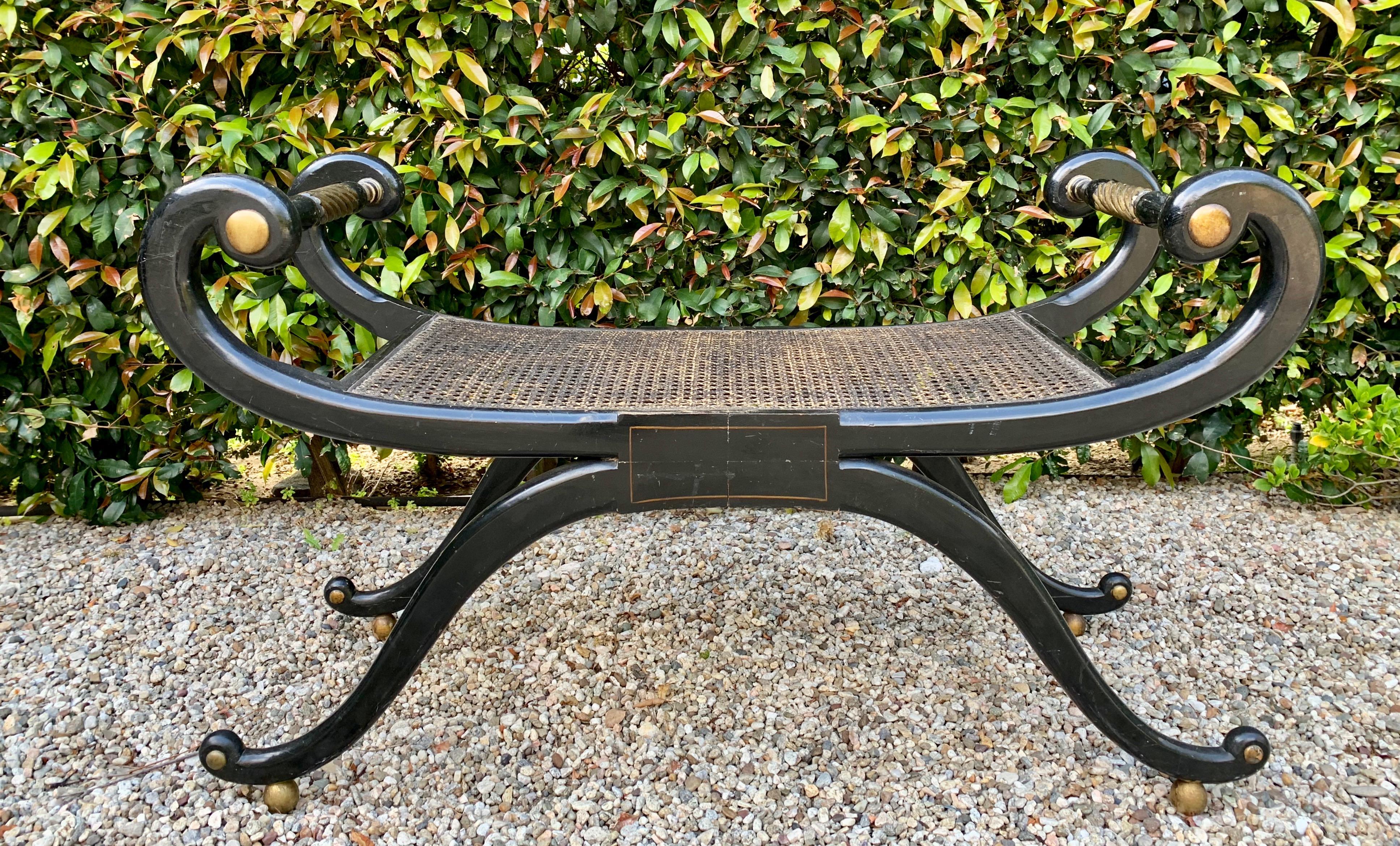 French scroll armed parcel gilt bench - a handsome compliment to any sitting room, near the fireplace or at the foot of the bed... and lovely in the Masculine or Feminine dressing room! A real show stopper, the seat is patinated cane - all in