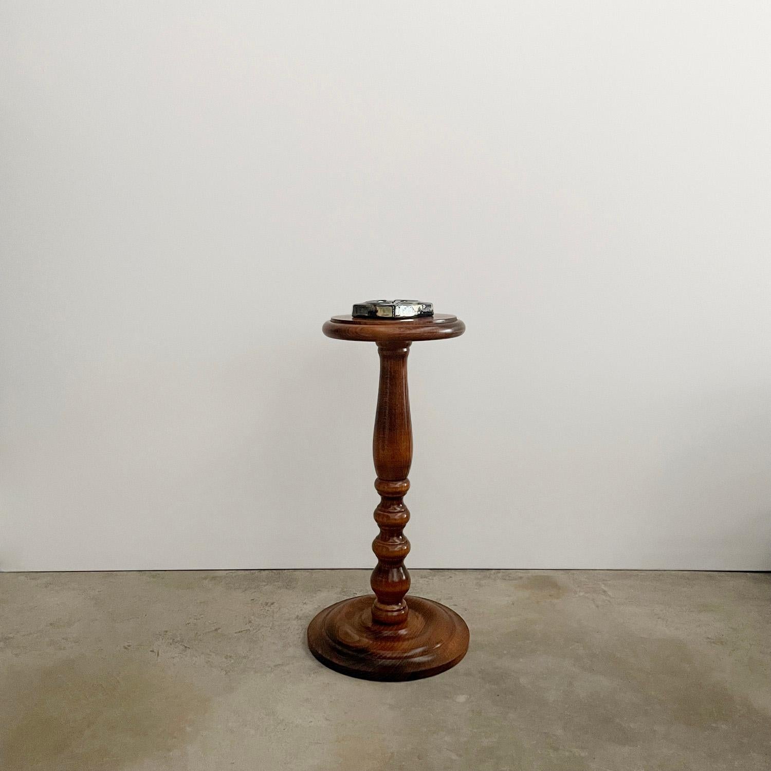 French sculpted wood cocktail table
France, mid century
Hand crafted solid wood artisanal piece
Double stacked tabletop which sits on a platform with rounded edges
Beautifully sculpted turned wood pedestal
Circular base with rounded grooves
Lovely