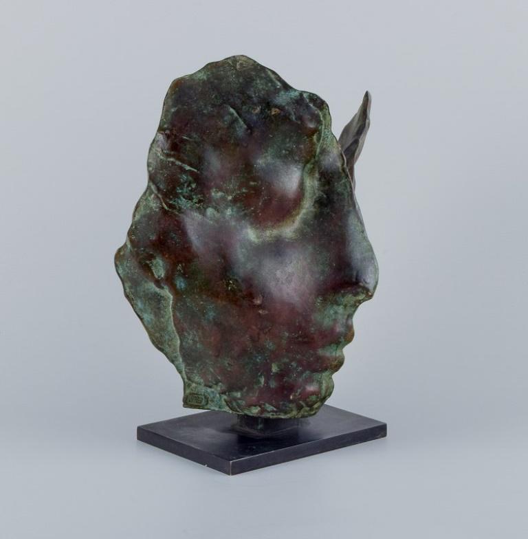 Modern French sculptor, double-sided face in solid bronze on bronze base.  For Sale