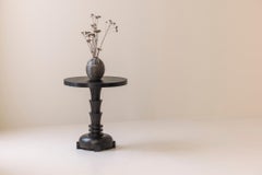 French sculptural dark stained side table from the 1980s