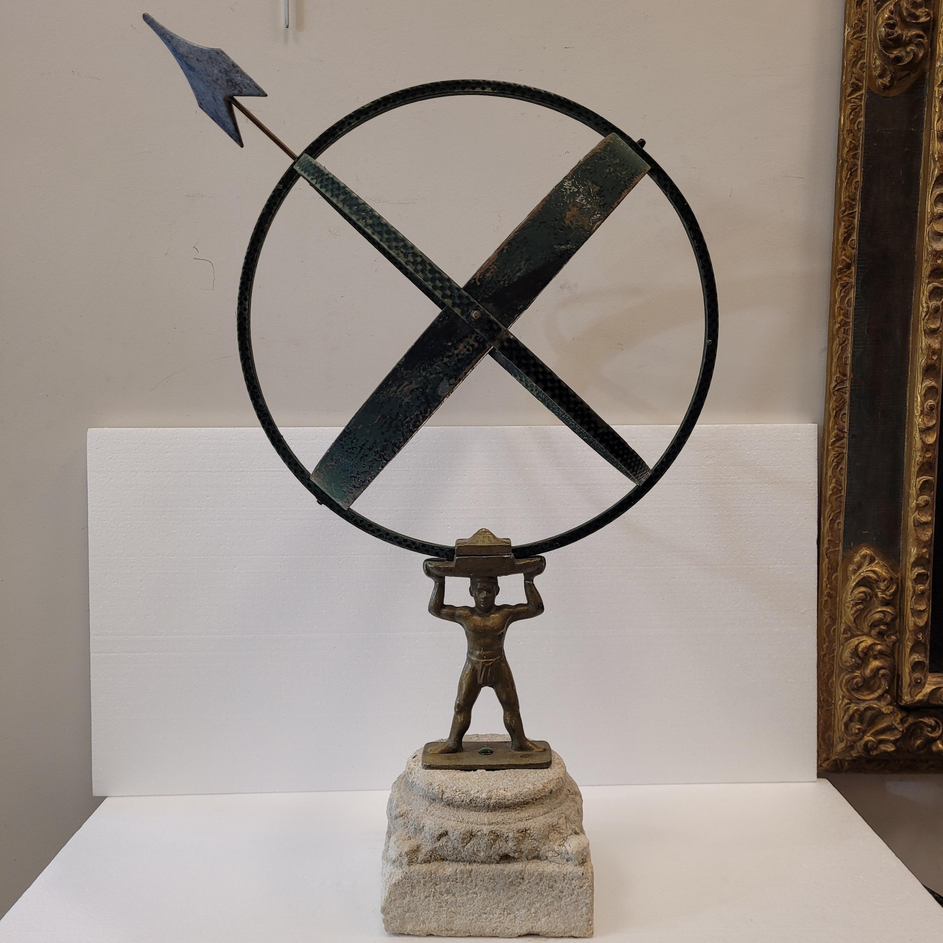 Amazing Antique sculpture from the mid-20th century, known as armilar sundial. It is a piece in good condition starring a bronze figure holding the sundial in the manner of an atlas holding the terrestrial globe, thus raising it to the sky. This