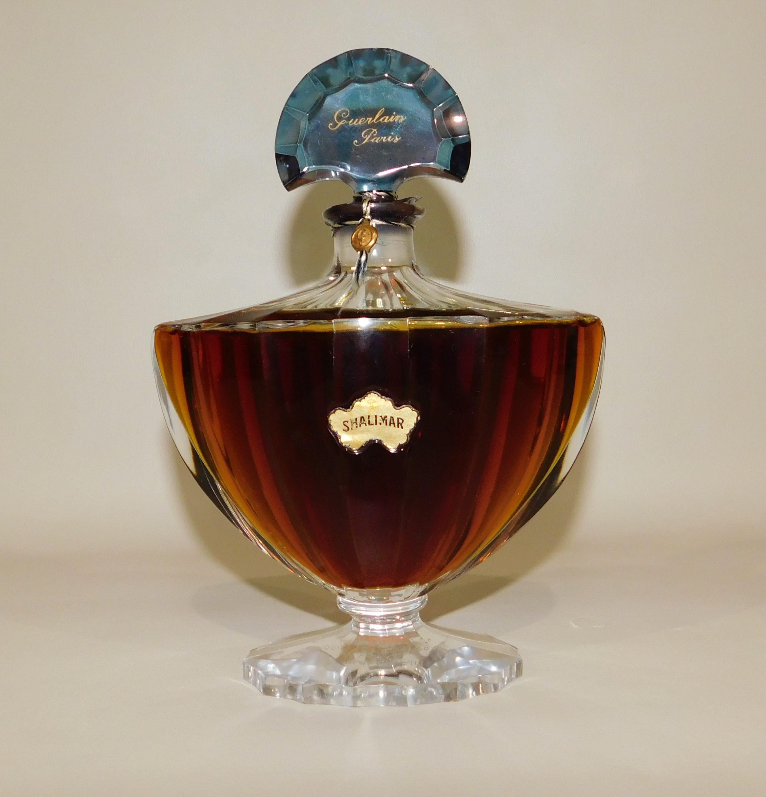 Vintage circa 1920s sealed golden amber Shalimar by Guerlain baccarat perfume bottle from Paris, France.

Flacon Chauve Souris (The Bat), circa 1924
Urn shaped flacon designed by Raymond Guerlain and produced by Baccarat to hold only the extract