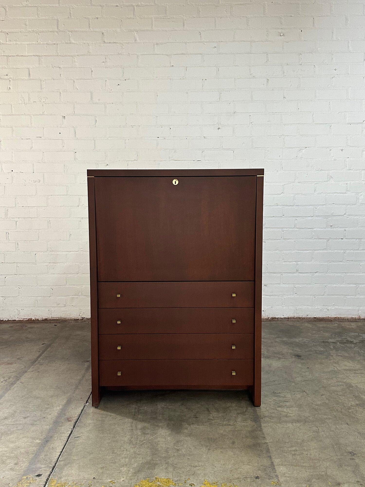 W35.5 D17.5 H49.5 KC25

Vintage 1980s drop down desk in a dark walnut finish. Item features brass inlay joinery, original textured hardware and comes with original key. Item shows in good restored condition. Desk is structurally sound and fully