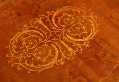 A French Serpentine Shaped Walnut Centre Table with Satinwood Inlay