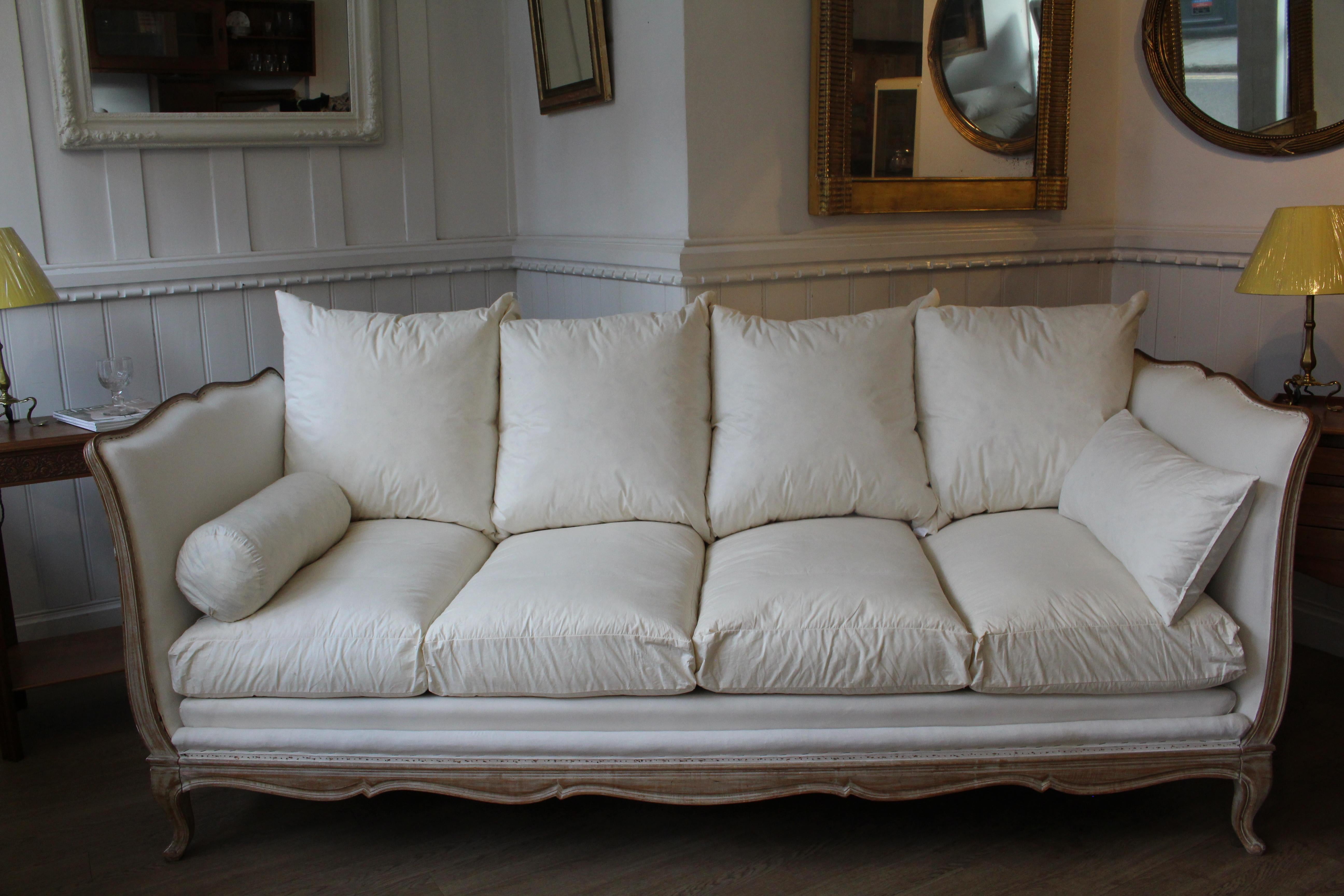 Beautifully shaped French daybed.
Newly re-upholstered in flame retardant calico, ready for new fabric to be applied.
This elegant piece can be used in the middle of a room as a daybed (with 2 long bolster cushions, which I will supply); or, as a