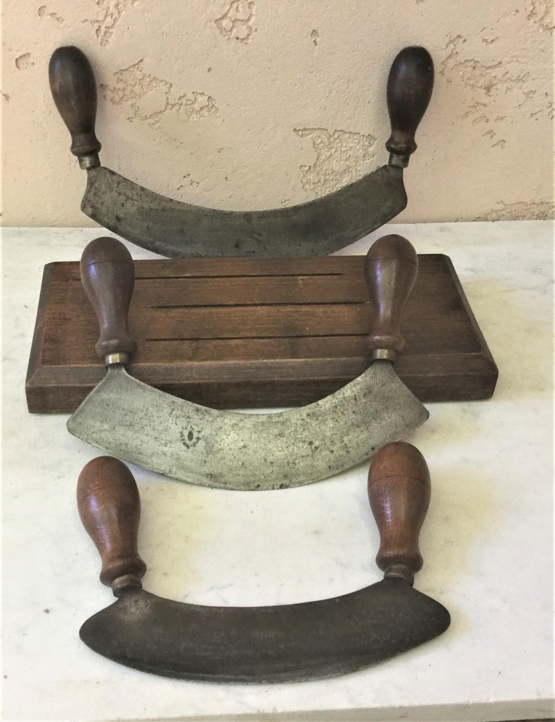 French set of 3 choppers in a wood stand with a forged iron blade and two turned wood handles.
Size of the choppers / 11.5