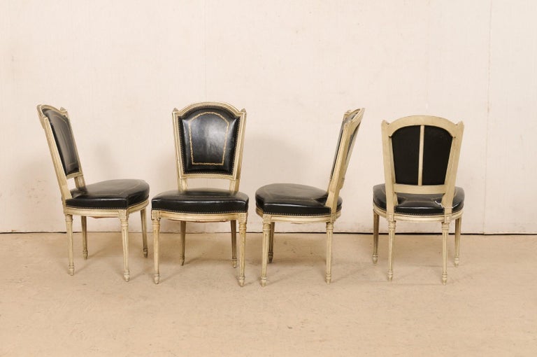 Embossed French Set of 4 Louis XVI Style Side Chairs W/ Black Leather Backs & Seats For Sale