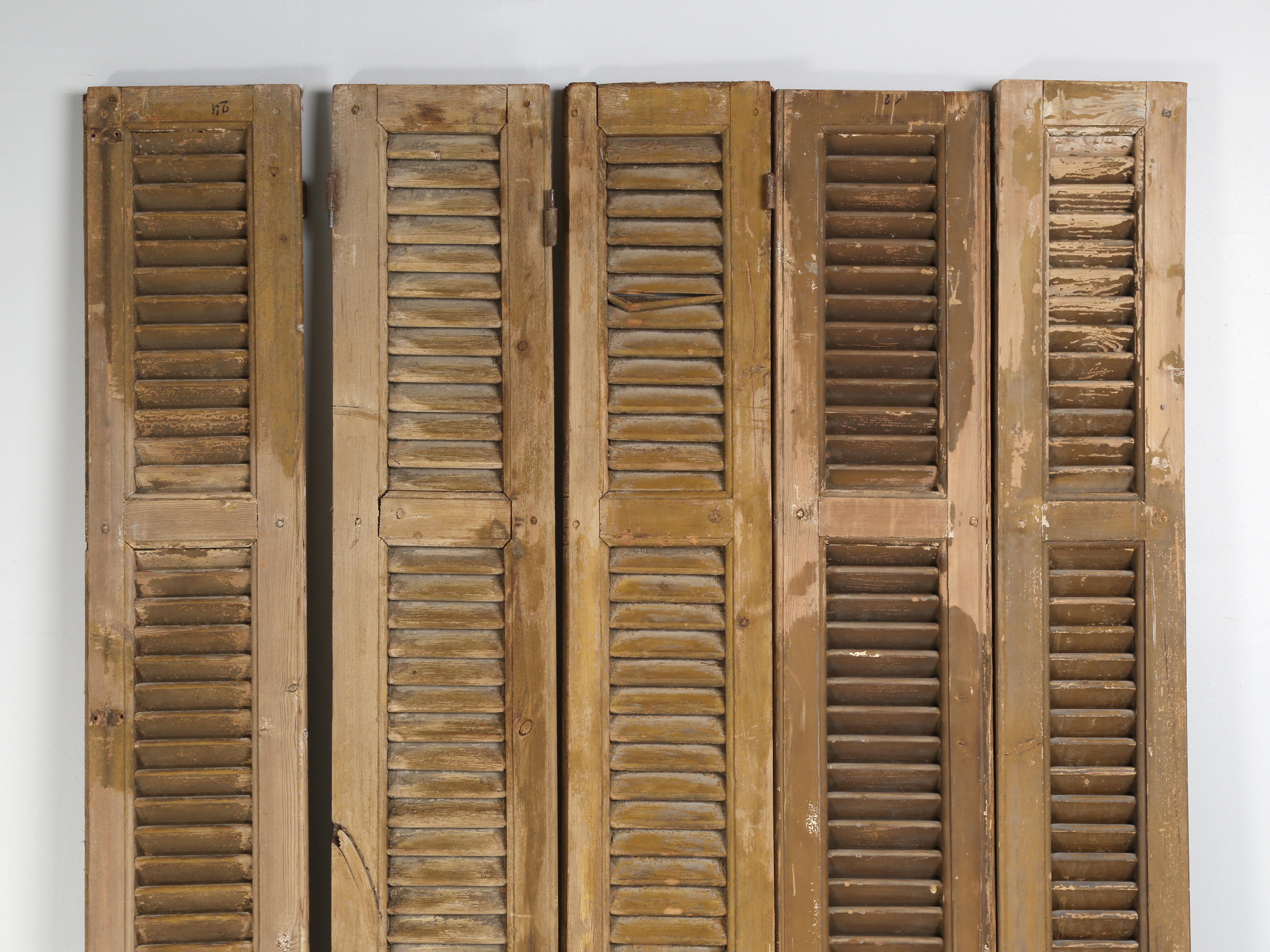 Set of (5) antique French shutters with a great patina. Ideal for creating a headboard or small screen.
We have a few dozen available and all are listed on 1stdibs, should you like to create a paneled wall?
**Please note damaged slat, image 4. The