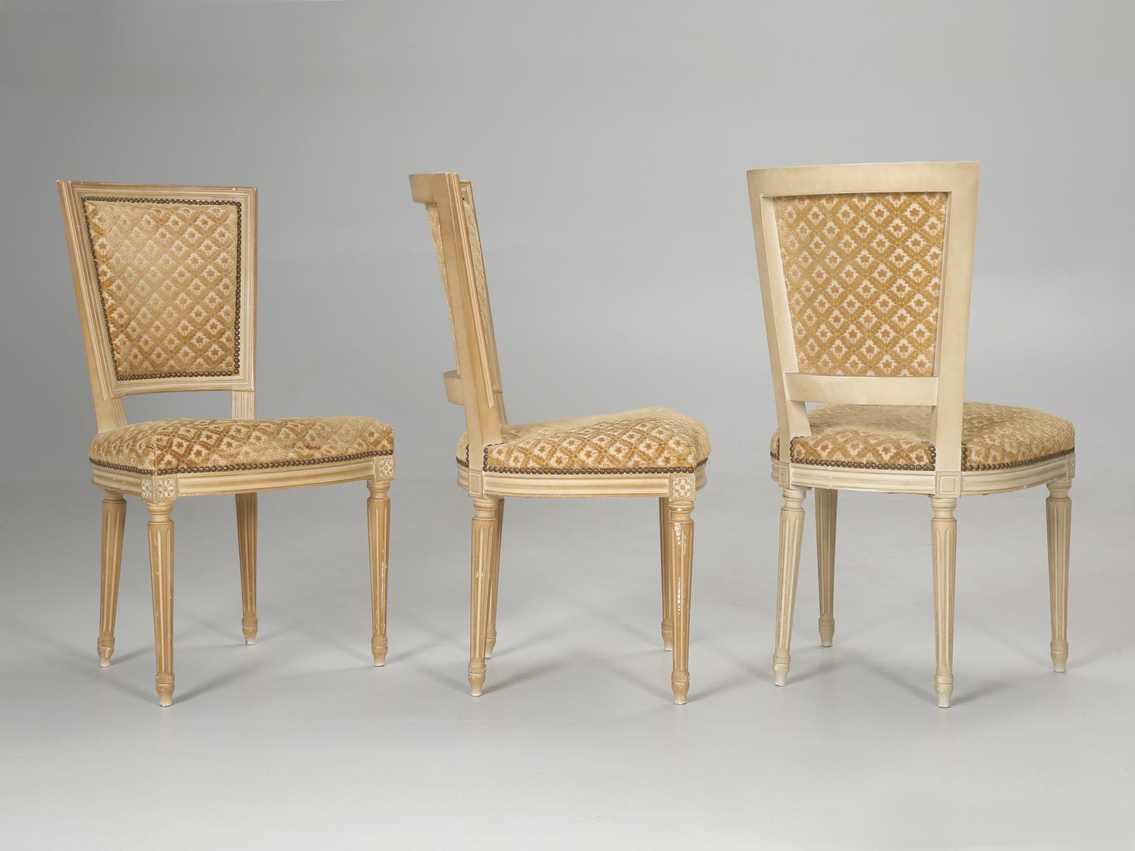 Vintage set of (6) French Louis XVI dining chairs in absolutely all original condition, which means they will require a trip to your favorite upholstery shop. The nice part is that no one played around with the paint, so the patina is still intact.