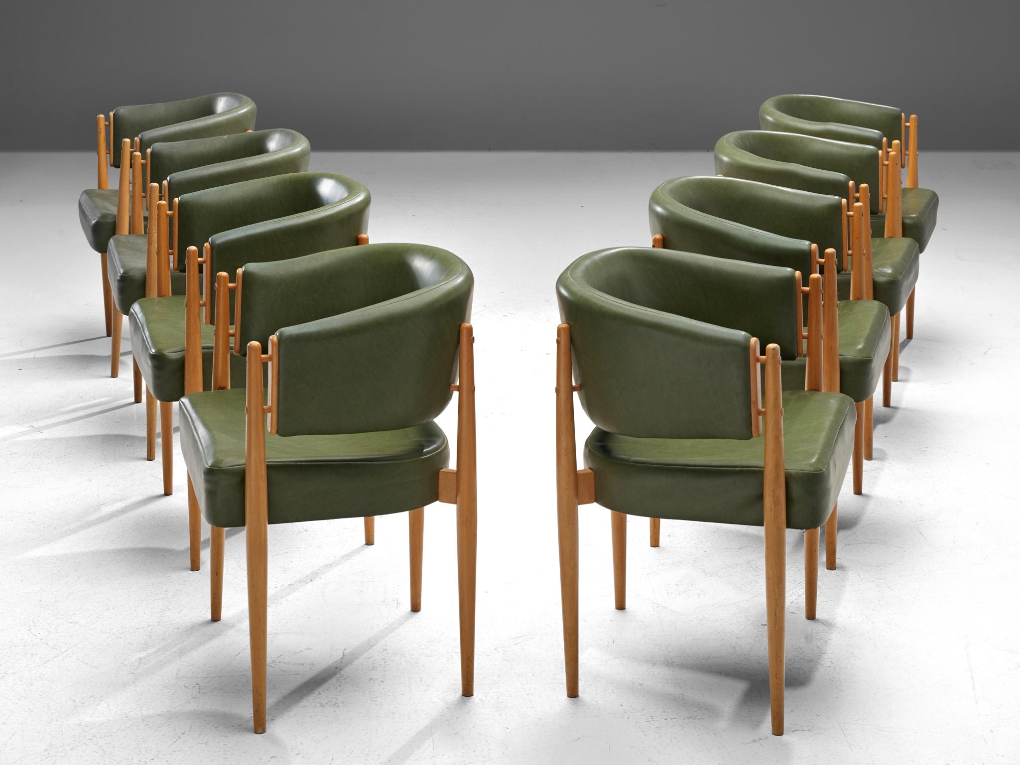Set of 8 dining chairs, beech and leatherette, France, 1960s

Elegant set of 8 dining chairs with a rounded backrest that surround the sitter, creating a comfortable and embracing feeling. The beech legs are tapered and run up all the way to the