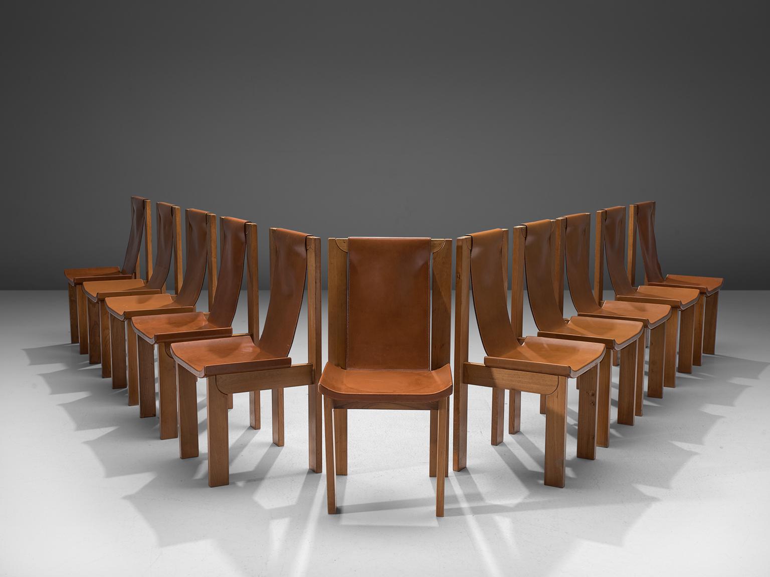 Cognac leather dining chairs with beech, France, 1960s.

Wonderful cognac leather chairs from France, with a geometric, architectural wooden frame. The leather seat is attached to frame on the sides and on the top. This results in a comfortable