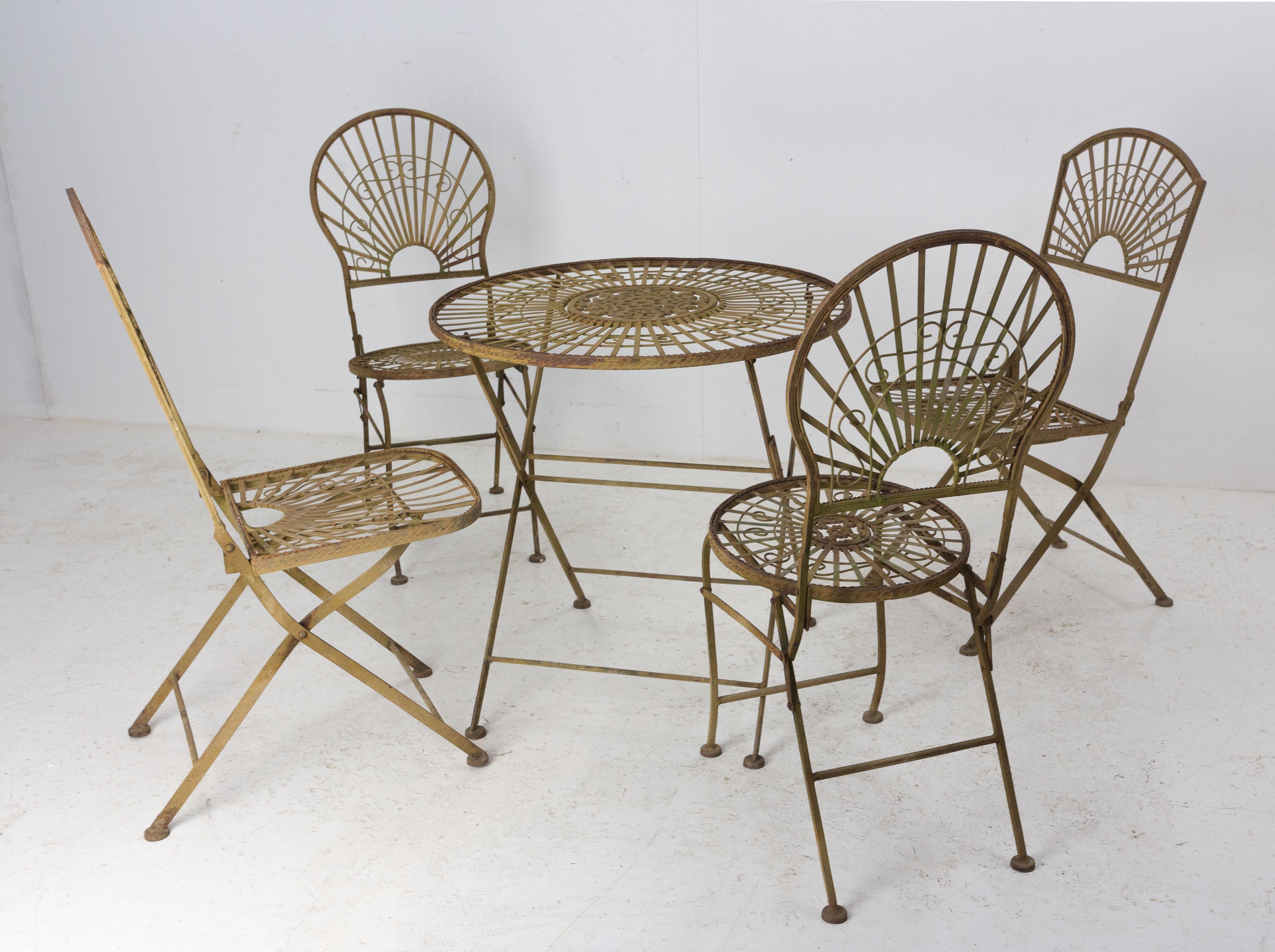 French folding iron chairs and table, with two different shapes of matching chairs.
Good condition with authenticate patina.
Each piece is fold-able.
Dimension: 
Rounded back chairs: D 19.68 in. W 15.35 in. H 35.43 in. Seat H 17.32 in. ( D 50, W