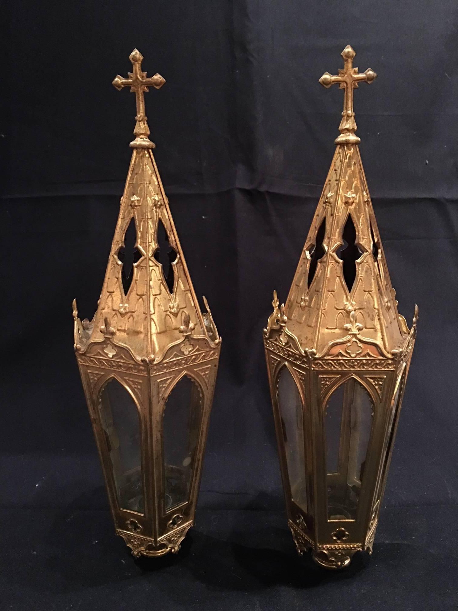 French set of four polished brass pole lanterns or candlesticks, 19th century.