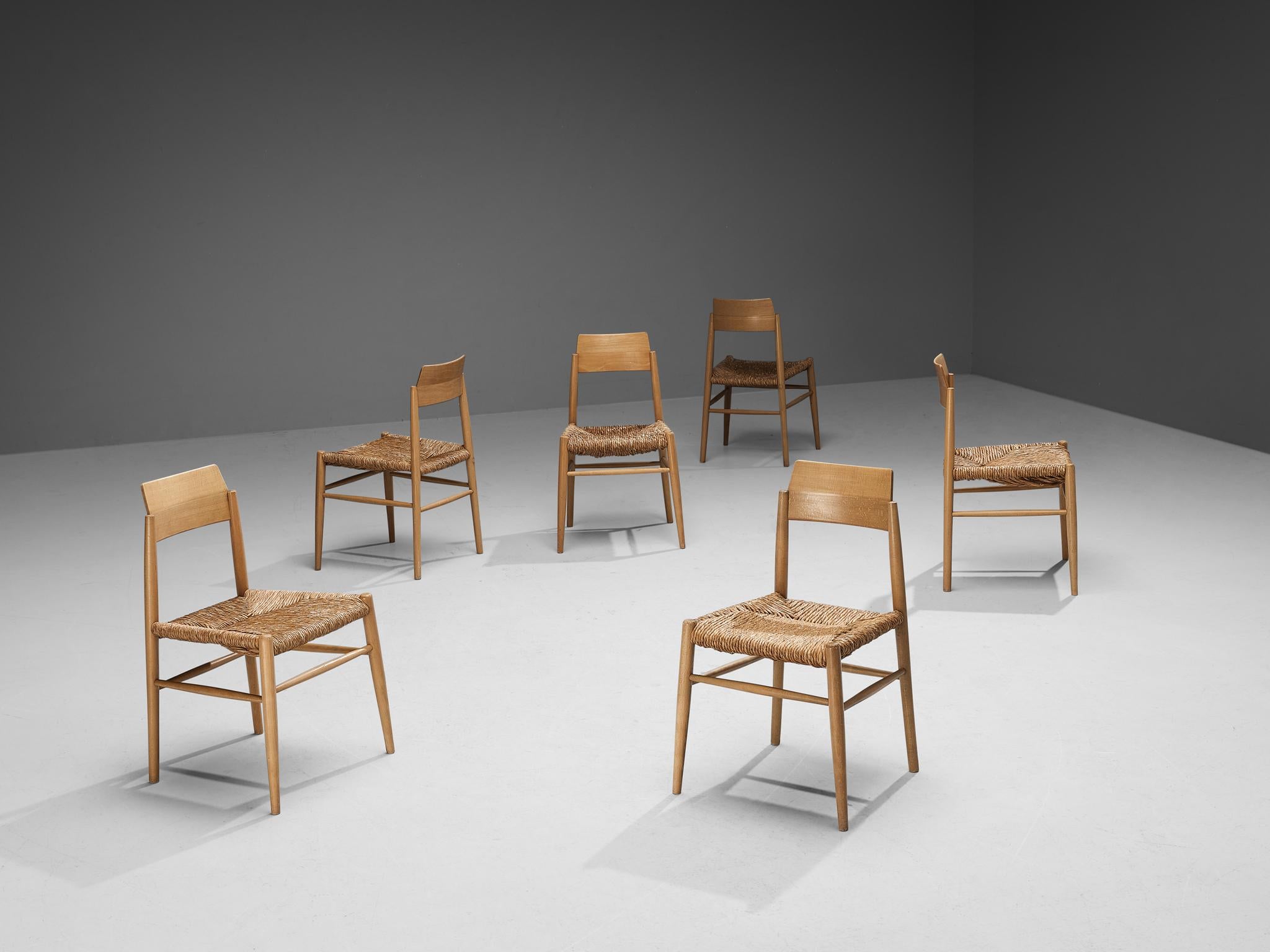 Set of six dining chairs, beech, straw, France, 1960s

Set of six beautiful French dining chairs executed in beech and straw. The design of these chairs is interesting because of the sleek and modern looks of the frames of the items. The straw used
