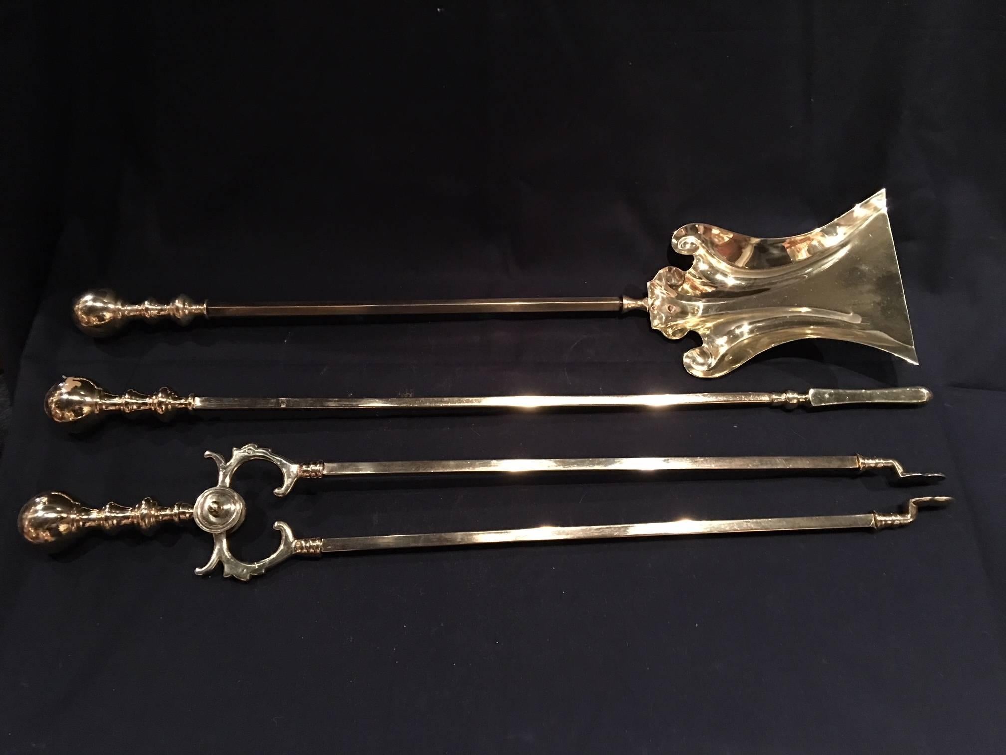 French aet of three polished brass fire irons, 19th century.