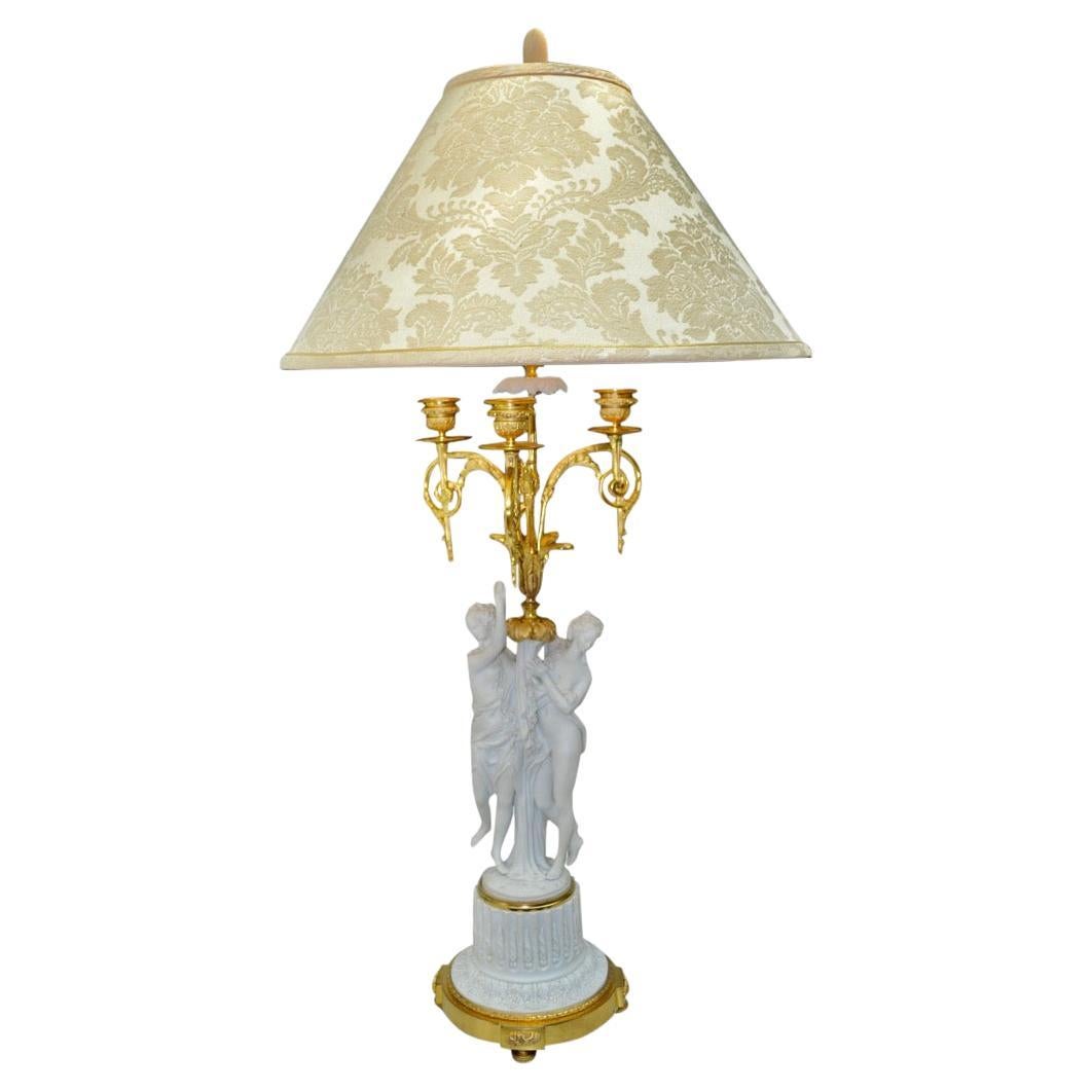 Lampe candélabre en porcelaine biscuit de Sèvres et bronze doré signée Feuchere en vente