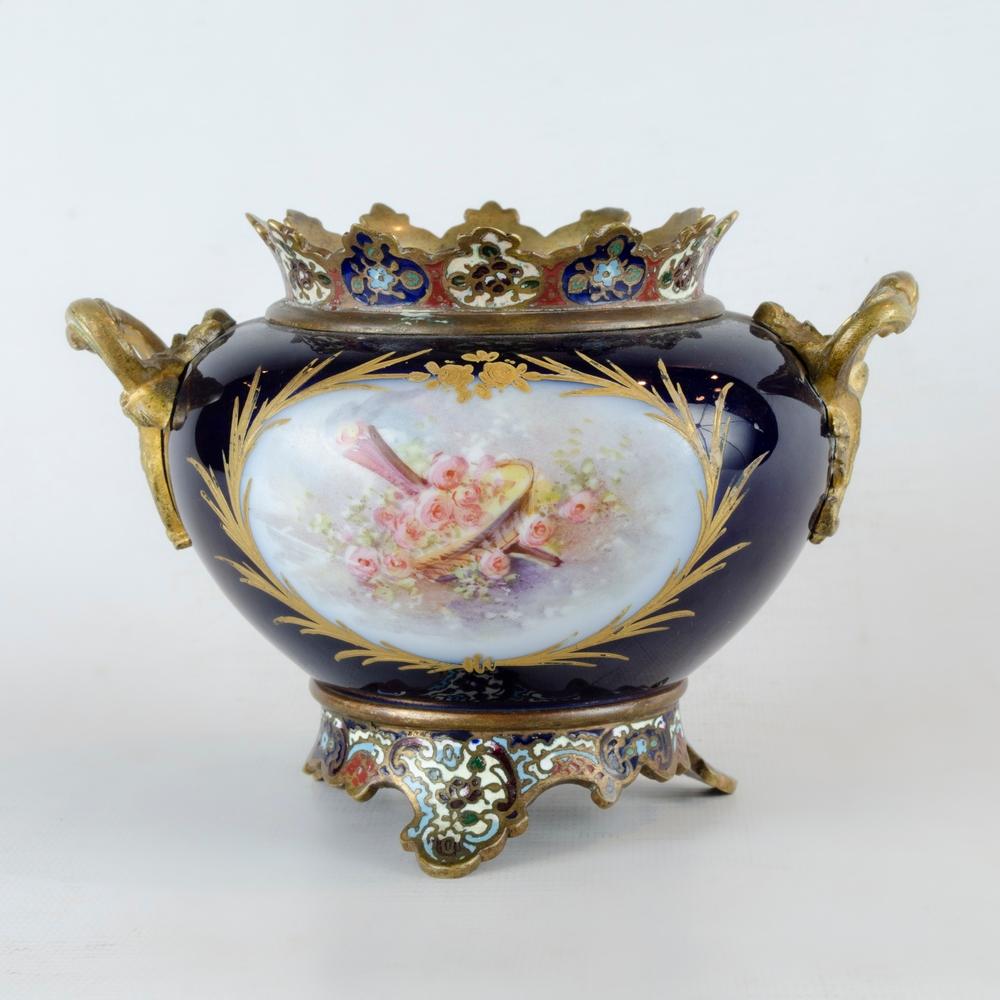 French Sevres bronze and porcelain vase, Cloisonne 19th century
Antique blue sevres porcelain masseter with intricate design on the base and neck, hand painted with a floral motif, on one side a basket of flowers and on the other two little angels
