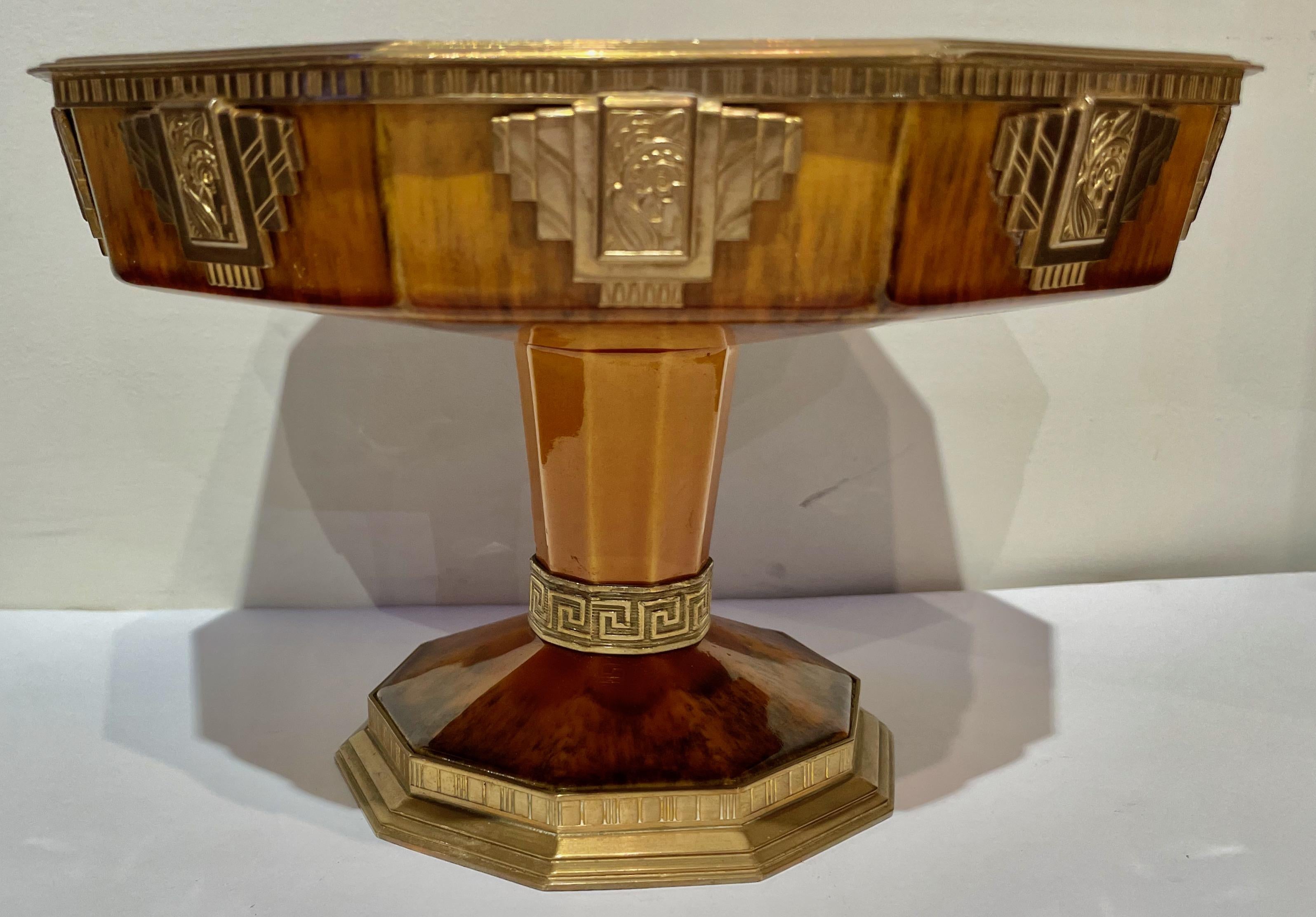 French Sèvres Centerpiece Art Deco Coupe with Metal Details. Unique design and very practical. Fine metalwork with stamped Art Deco medallions circling the top. Additional stepped base with more details, and a “Greek key” design going around the