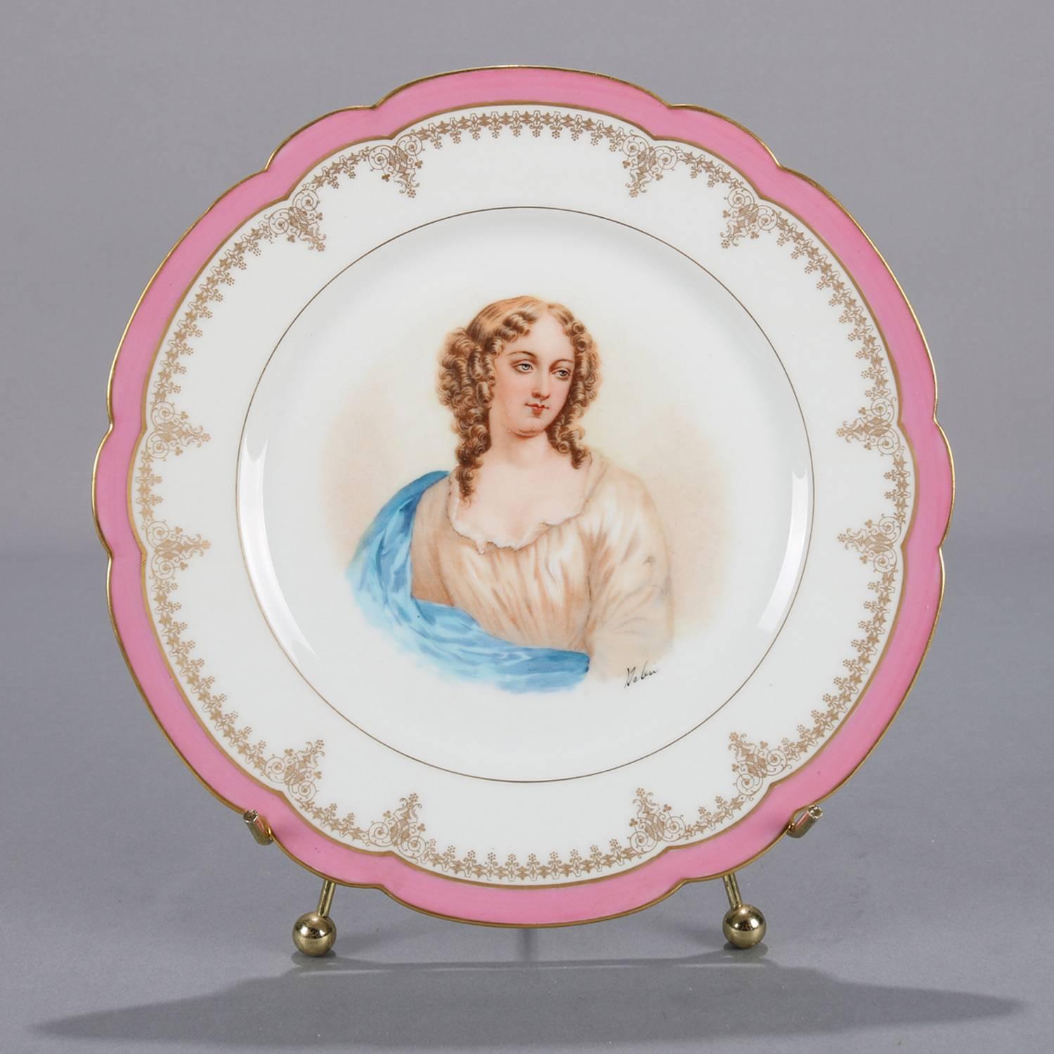 Antique French portrait plate by Sevres for Chateau de St Cloud features well with central artist signed portrait of Madame de Pavalliere by Debrie, rim with gilt scalloped edges and decorated with rose pink and gilt foliate motif, en verso stamped