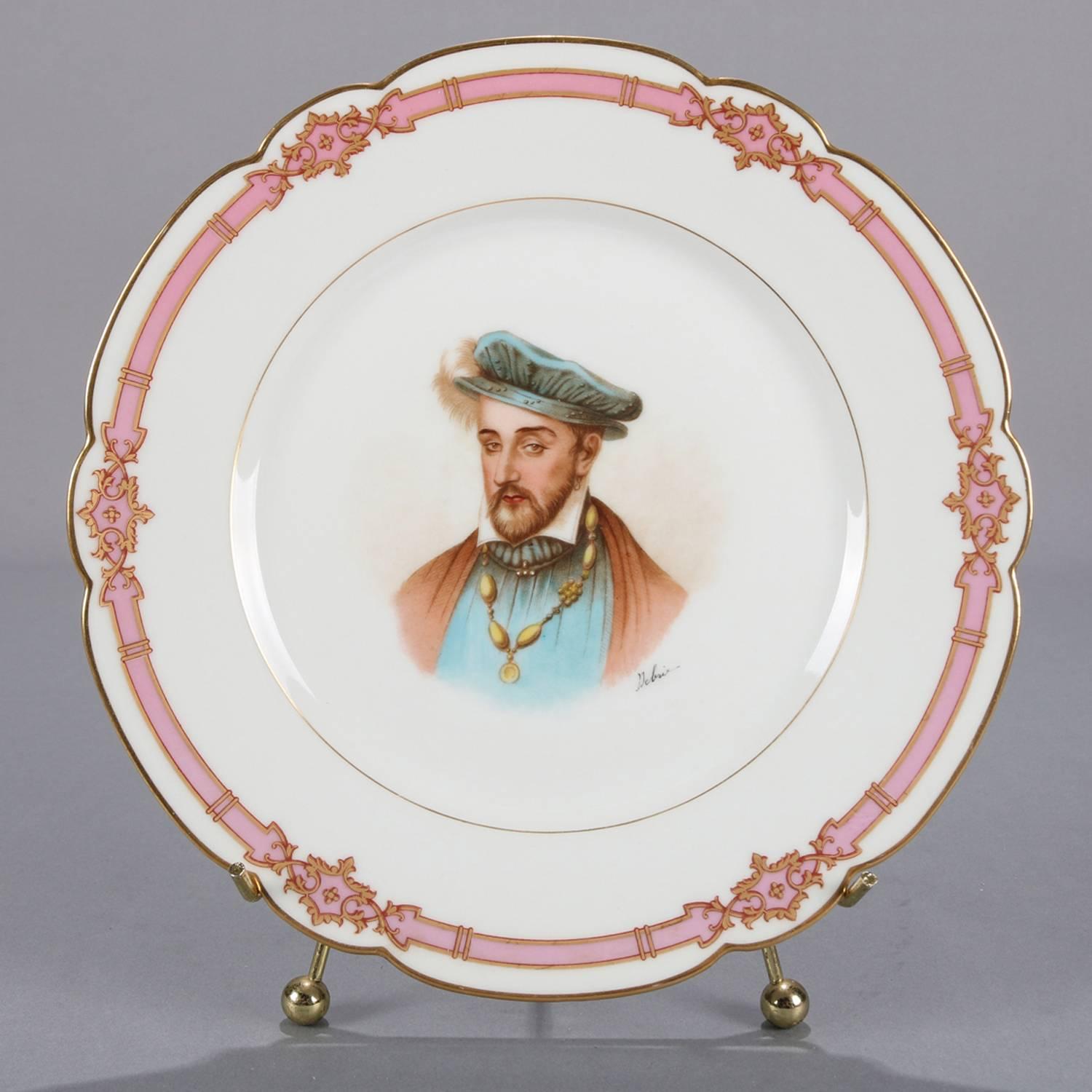 Antique French portrait plate by Sevres for Chateau de St Cloud features well with central artist signed portrait of Henri II Roy by Debrie and framed with gilt repeating and stylized fleur de lis pattern, rim with gilt scalloped edges and decorated