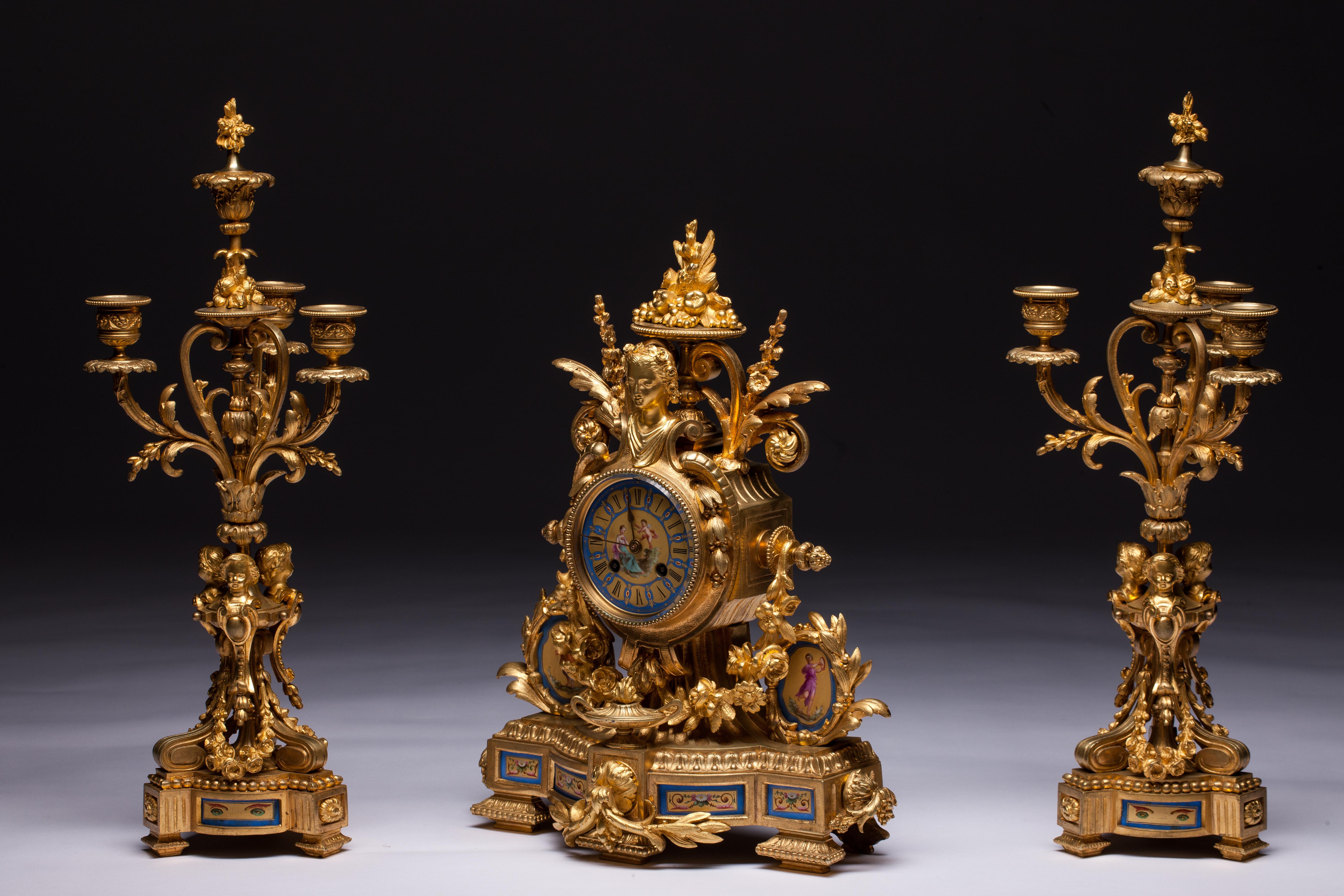 French Sèvres Porcelain clock set, two beautiful candelabra and clock. Porcelain face marked 