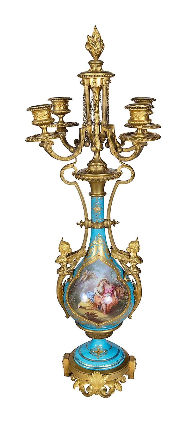 A very good quality French 19th Century Louis XVI Sevres style clock garniture. Having reclining maidens with garlands of flowers supporting an urn above the clock face. Turquoise porcelain with beaded and gilded decoration. Hand painted classical