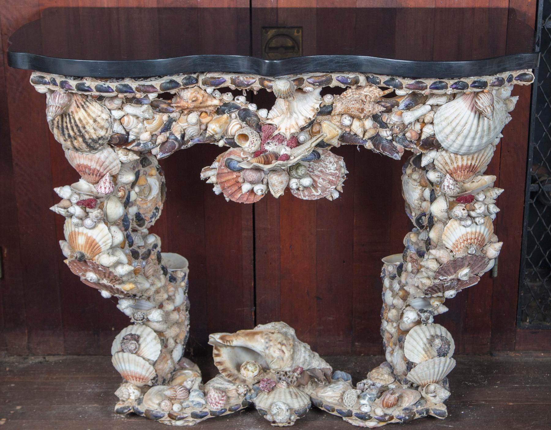 1930s Atlantic seashells on a cement console table, France.
Shaped honed marble top approximately 2