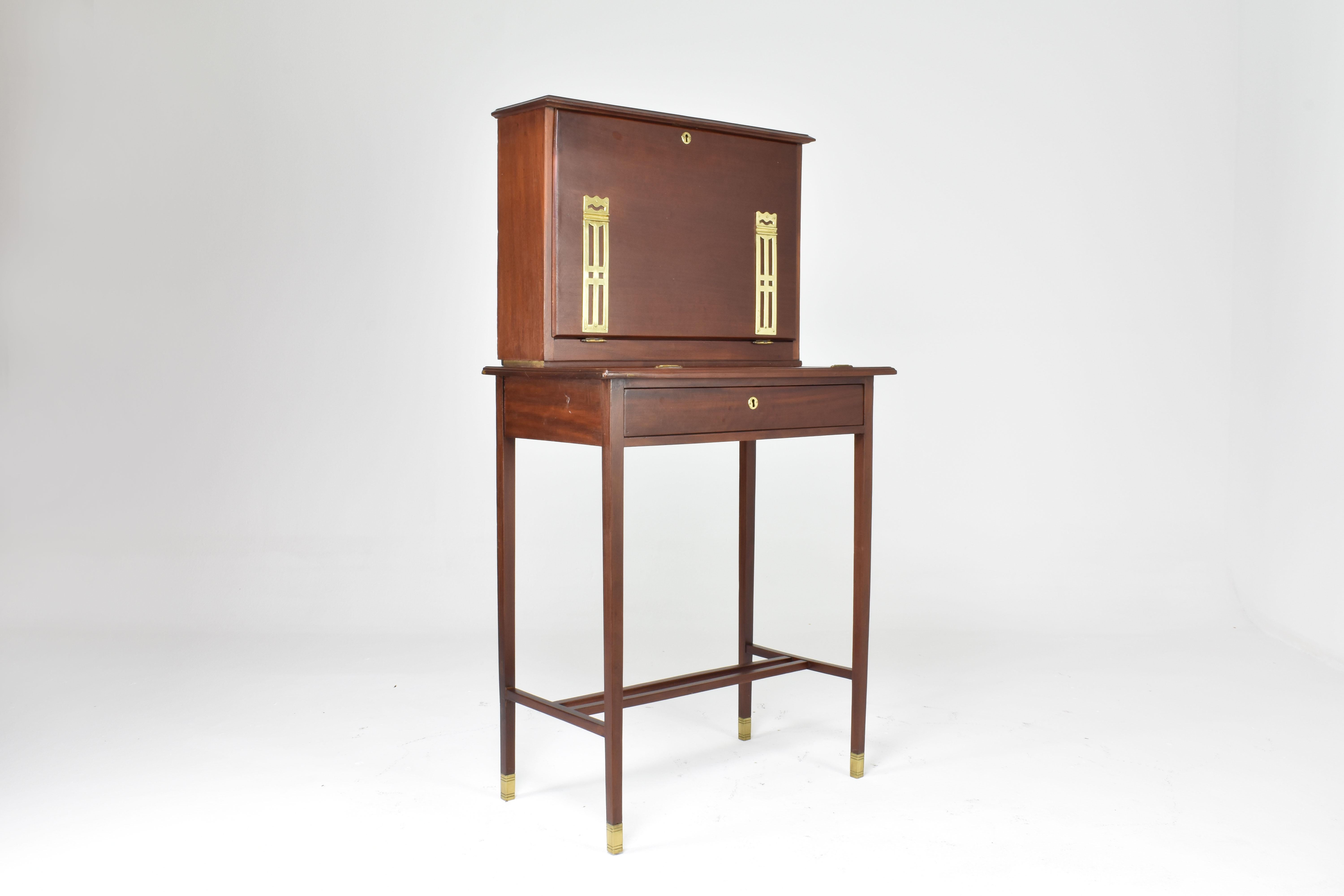 A 20th-century vintage desk from the 1930s of Sheraton Revival style, drawing inspiration from the renowned British furniture designer Thomas Sheraton of the late 18th century. Sheraton's legacy was marked by refined craftsmanship and influences