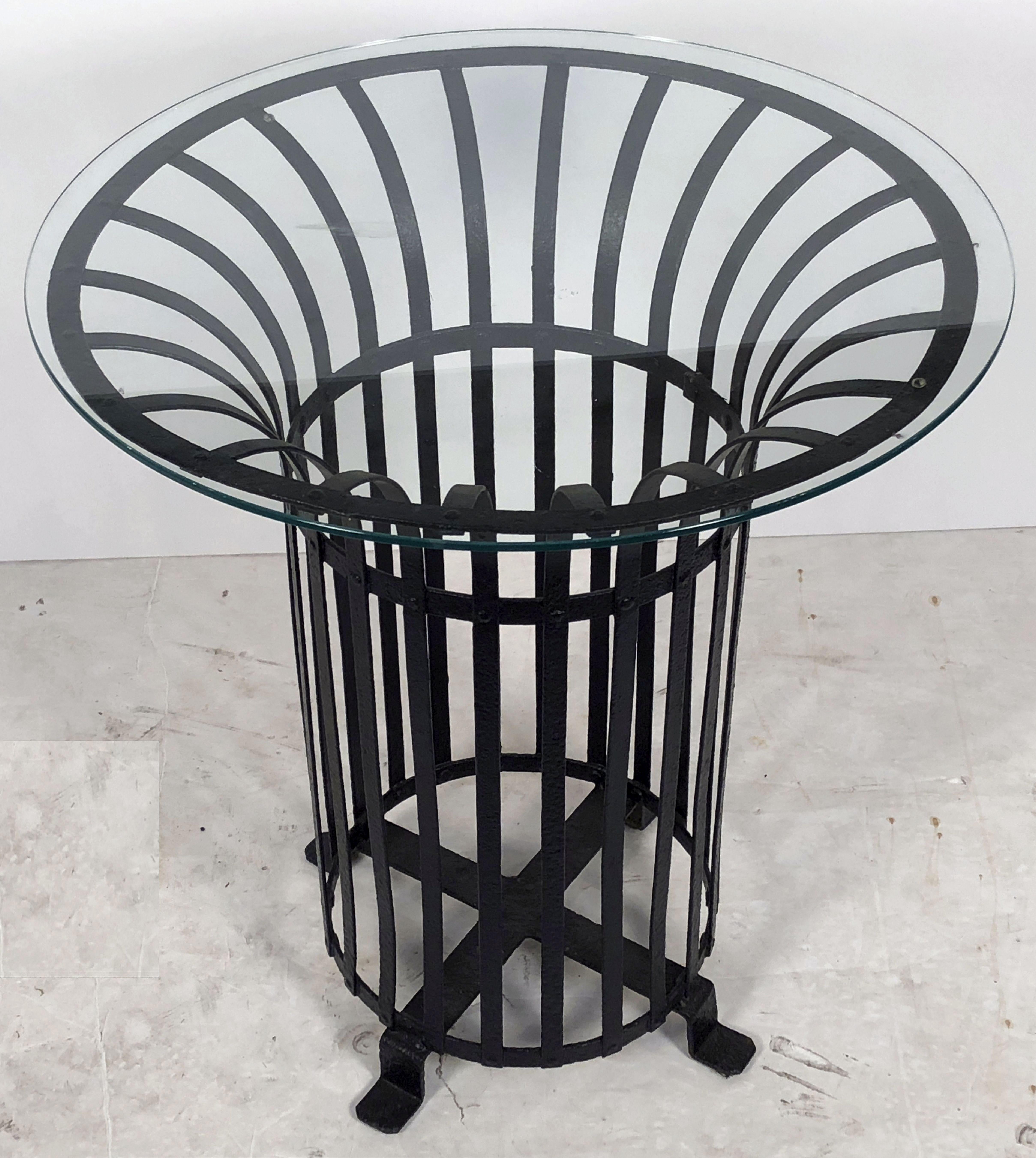 A pair of fine French round or circular side or occasional tables for indoors or outdoors - perfect for a garden, patio, or garden room.
Each table featuring a round glass top set upon a sturdy and stylish wrought iron base.

Dimensions of each