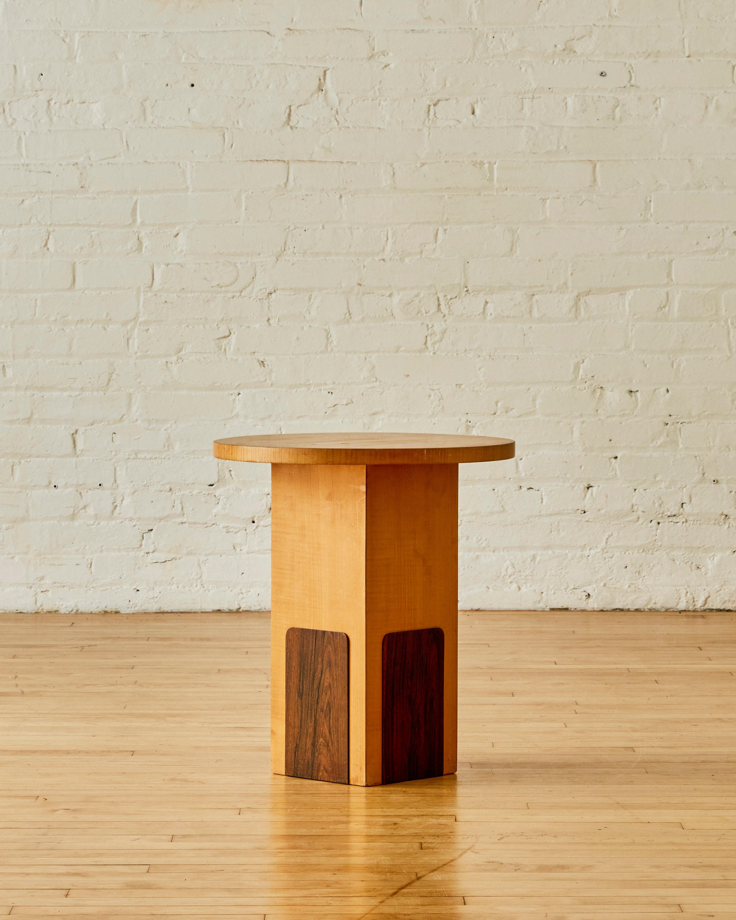 French side table by Michel Duffet featuring a round tabletop and rectangular base in sycamore wood with rosewood details.

Michel Dufet (1888-1985) was a French furniture designer who was active in the early 20th century. He was a member of the Art