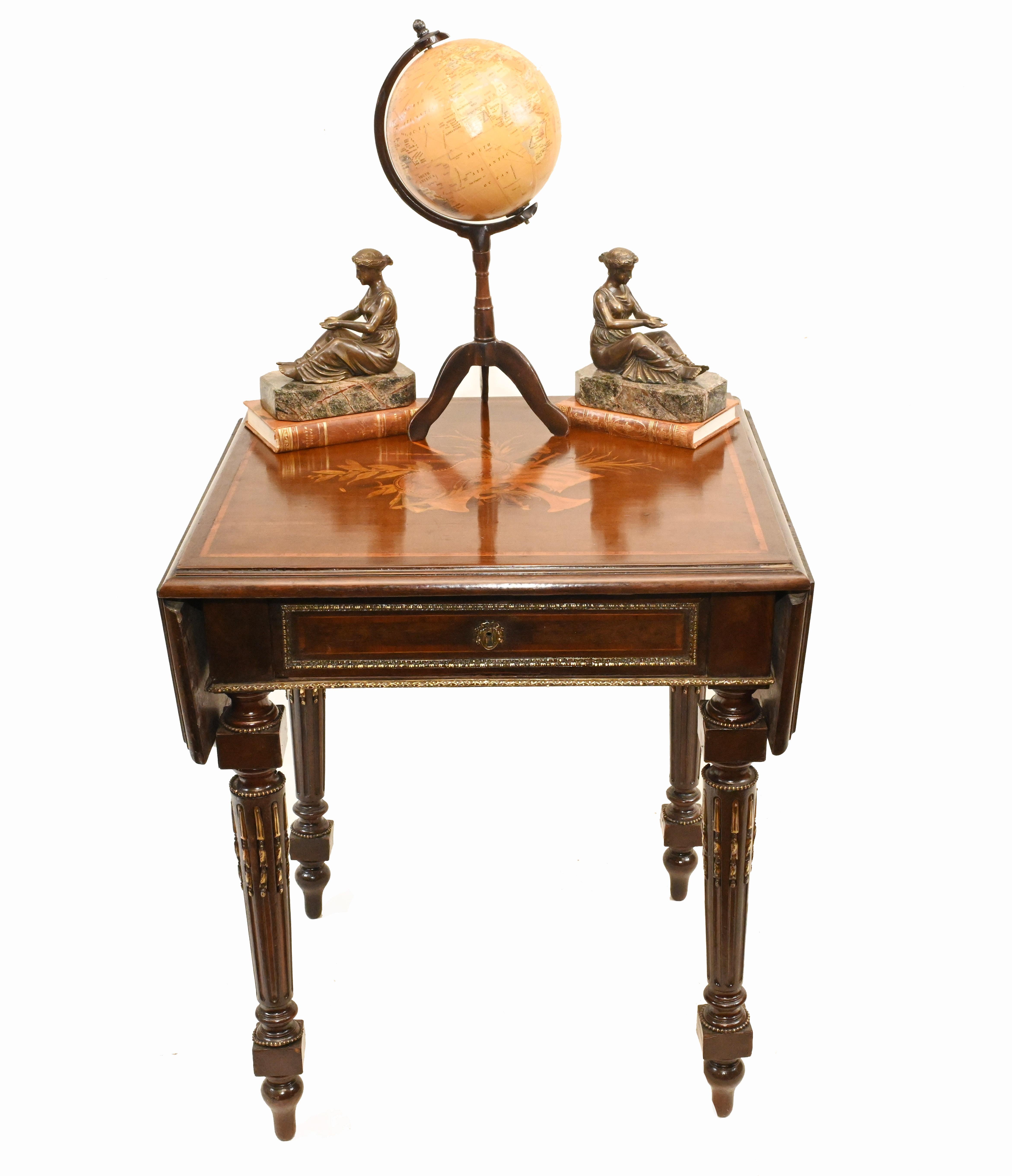 Refined French drop leaf Empire side table
Table top becomes bigger via extending with the drop leaf
Intricate marquetry inlay to the top featues floral motifs
Bought from a dealer on Marche Biron at Paris antiques markets
Offered in great shape
