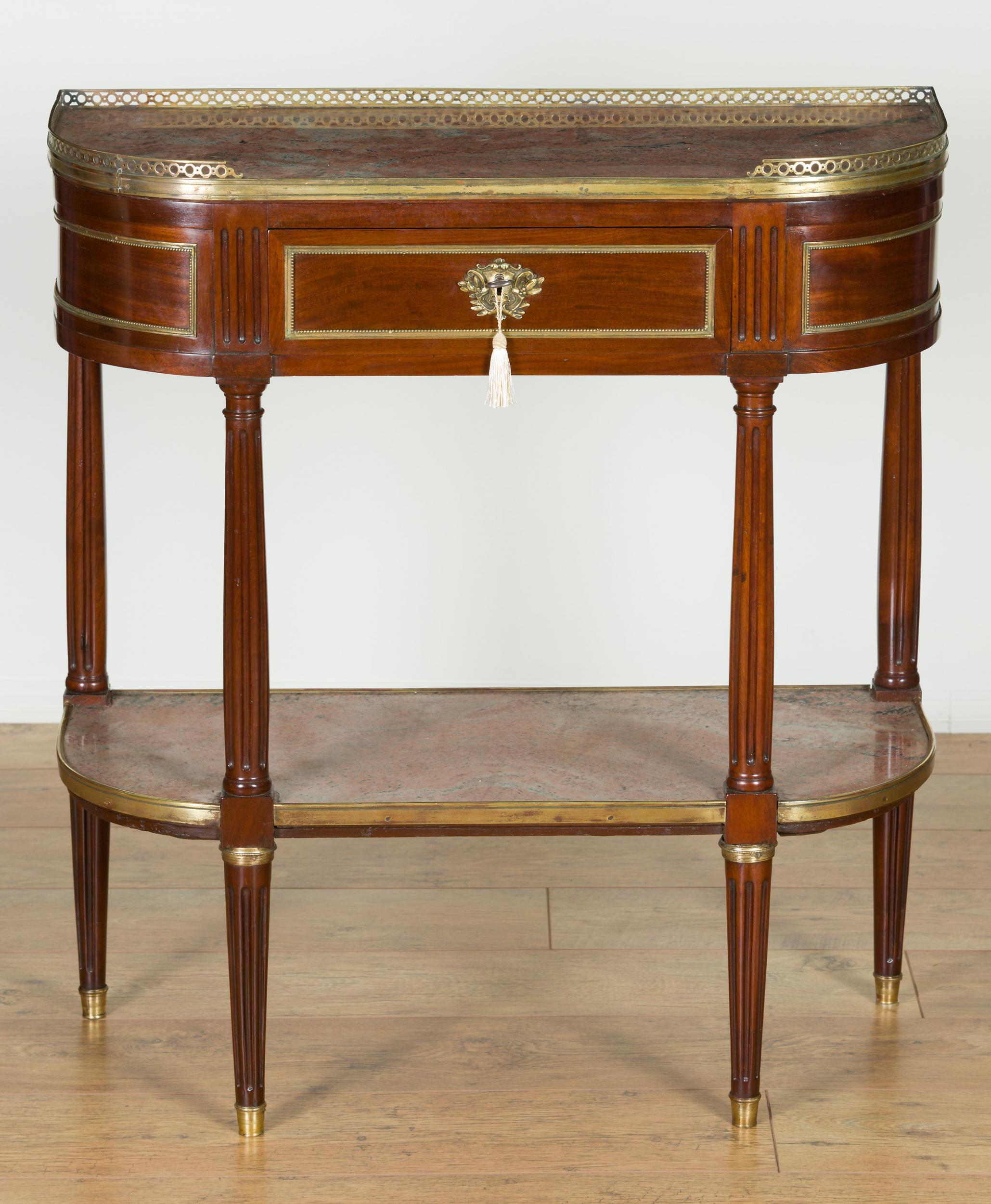French side table in the manner of Gabriel Viardot.

French mahogany and gilt mounted side table in the manner of Gabriel Viardot.

Rouge marble top with three quarter gallery above a single blind frieze drawer.

Four fluted supports with