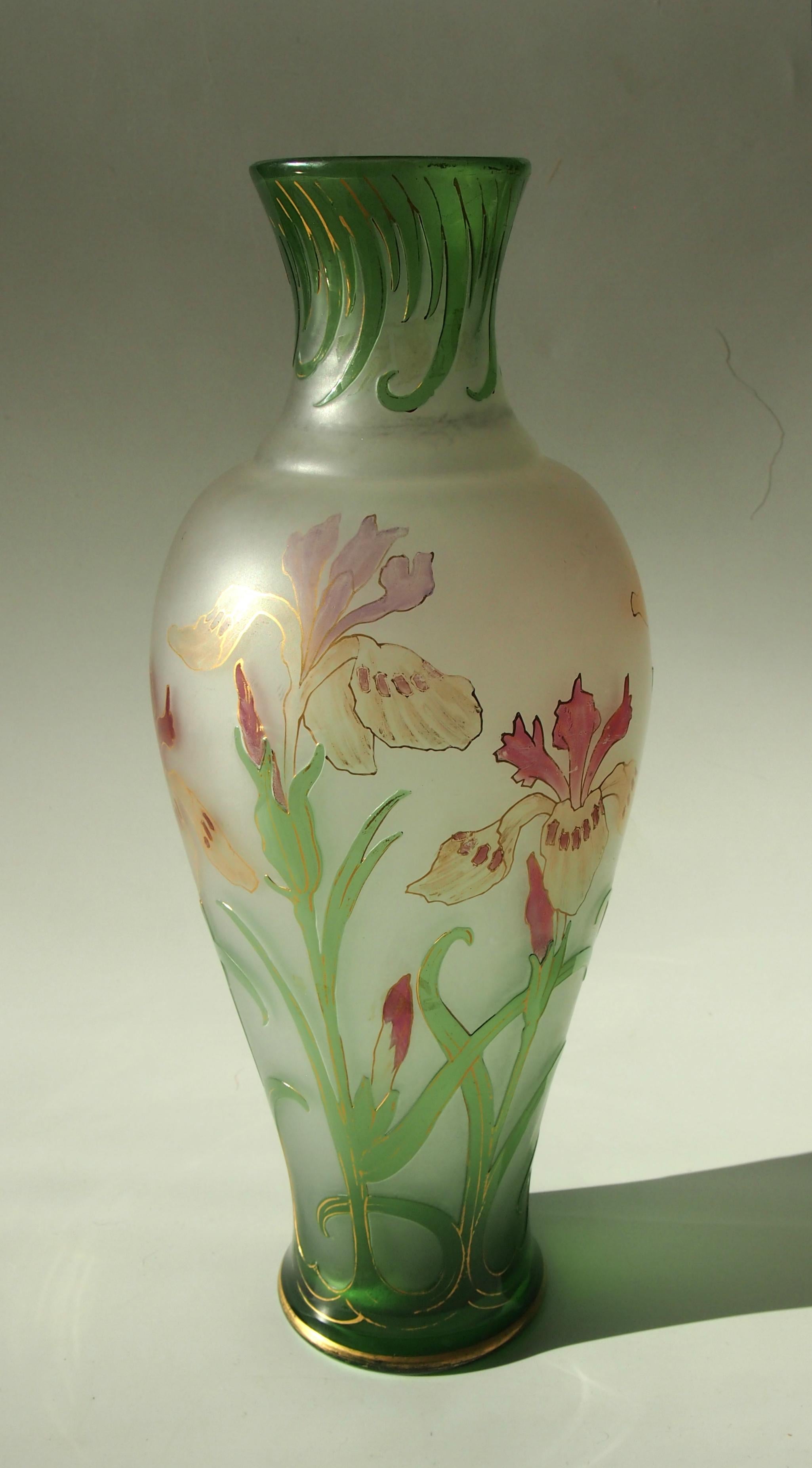 Superb early French Art Nouveau green over clear cameo, gilded and enamel glass vase by Cristallerie De Pantin depicting Irises. The green layer is cameo the pink flowers are enameled. This is an exceptionally early French Cameo circa 1889. Nicely