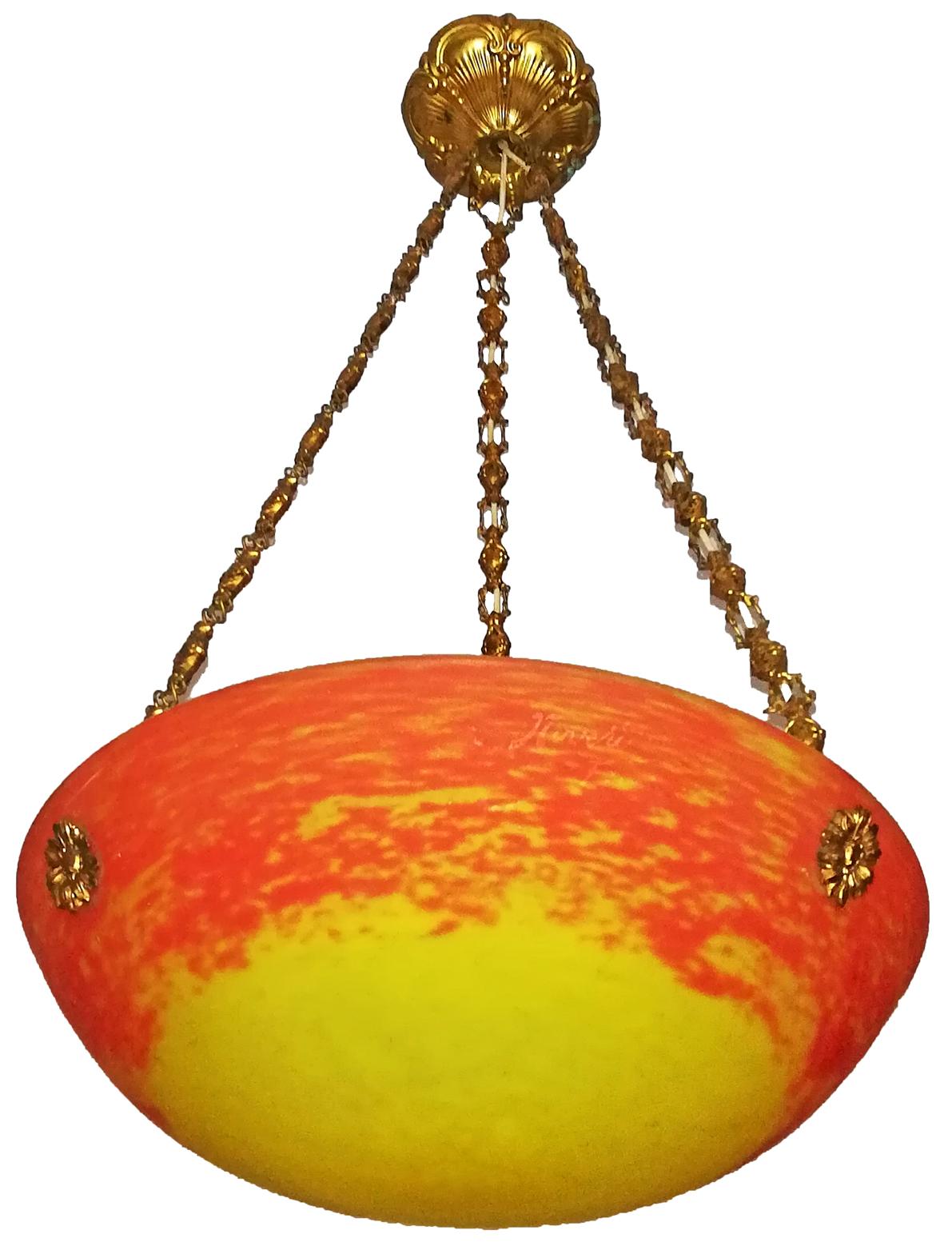 Beautiful signed, French Art Deco gilt chandelier or pendant with colorful orange red, yellow art glass shade in the manner of Degué, Muller Freres and Daum Nancy.

Measures:
Diameter 15 in / 36 cm 
Height 28 in / 70 cm
Weight 7 lb. (3 kg)