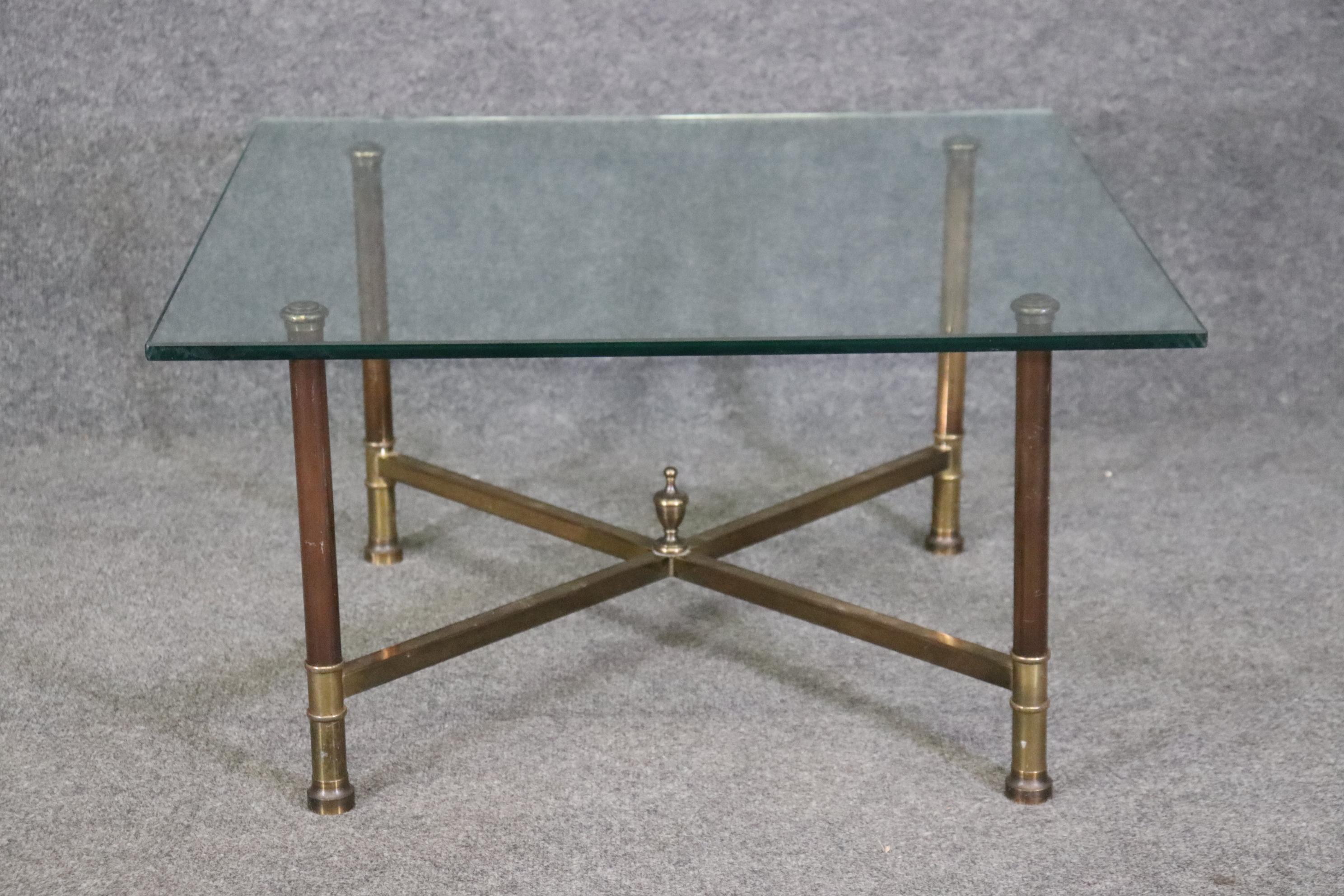 Dimensions: Height: 15 1/2 in Width: 28 in Depth: 28 in 
Large Glass Dimensions: H: 15 1/2in W: 36in D: 36in 

This French Maison Jansen Regency Style Brass Glass Top Coffee Table is not only of the highest quality, it is signed Jansen Paris! Maison