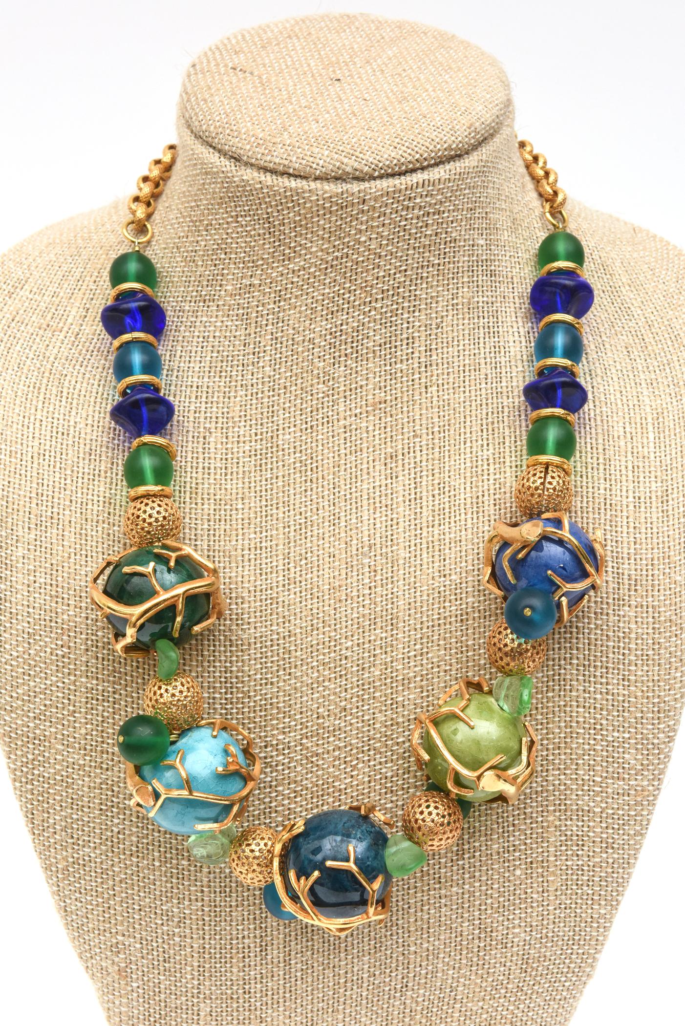 This stunning work of jewelry designer signed French necklace is by Philippe Ferrandis and looks like art and sculpture. It is labeled and also noted Paris. The luscious colors of the sky and sea incorporate the colors of turquoise, purple, green,