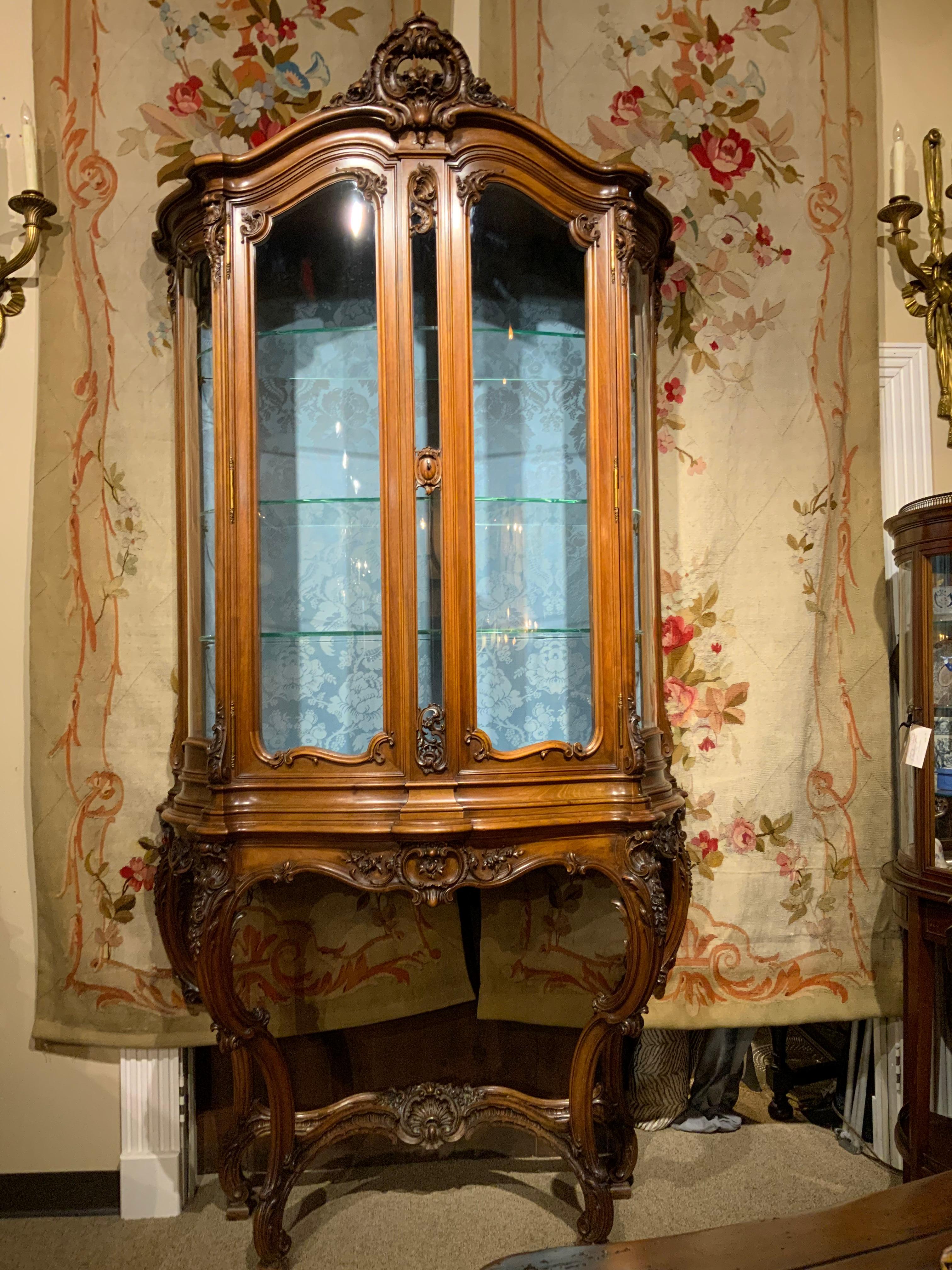 Exceptional display cabinet that is signed with engraved signature at the top
Of the base. A Paris label is evident when the doors to the upper structure are
Open. The carving in this piece is of the best quality. The design is Louis XV-
Style