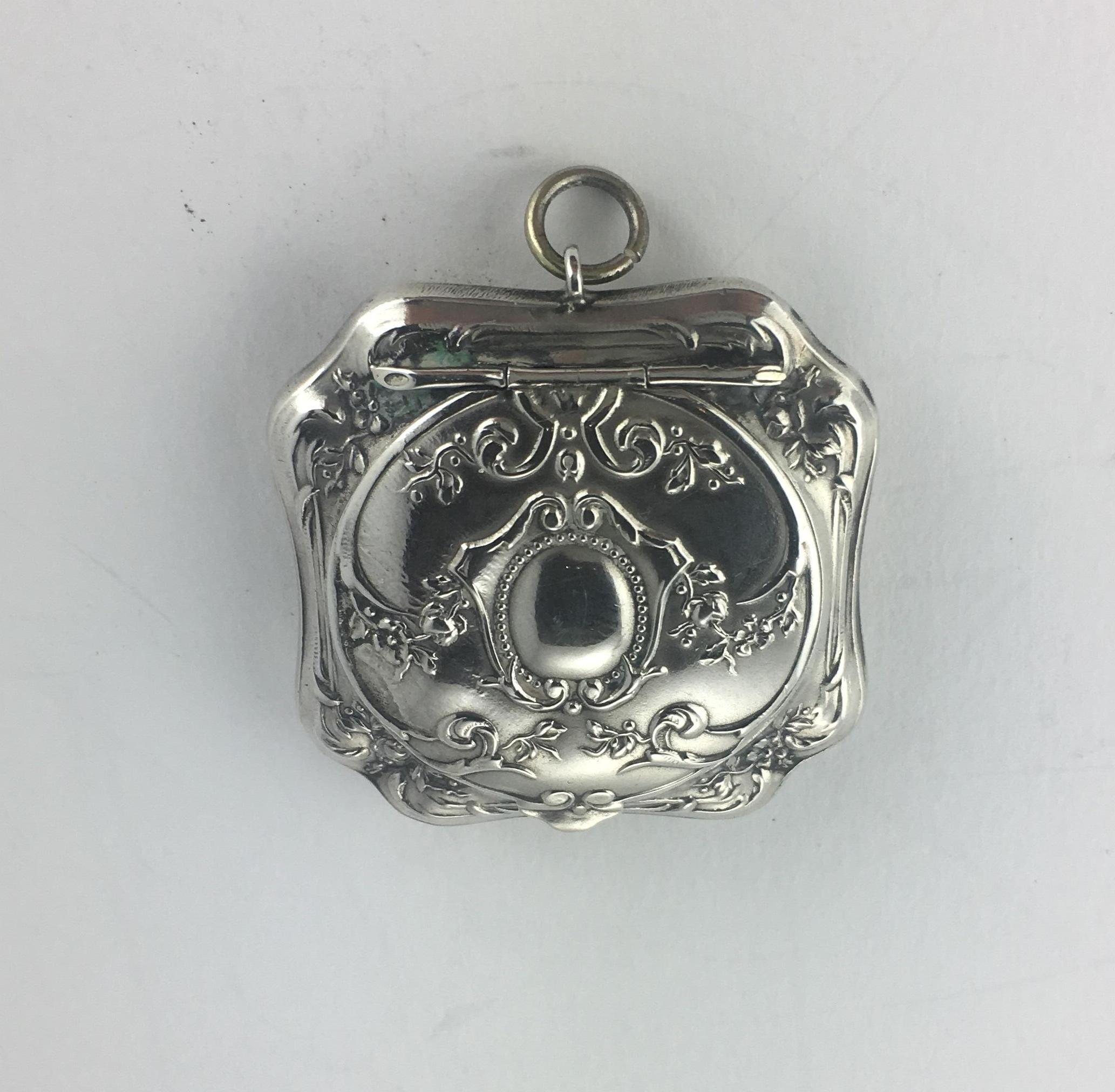 Art Nouveau silver sovereign holder.
Opens and closes well. A very nice example.
I believe this to be sterling silver however marks are not visible.

The measurements are 2 inches H x 1 5/8 inches W and 3/8 inches D. Very good condition.

 