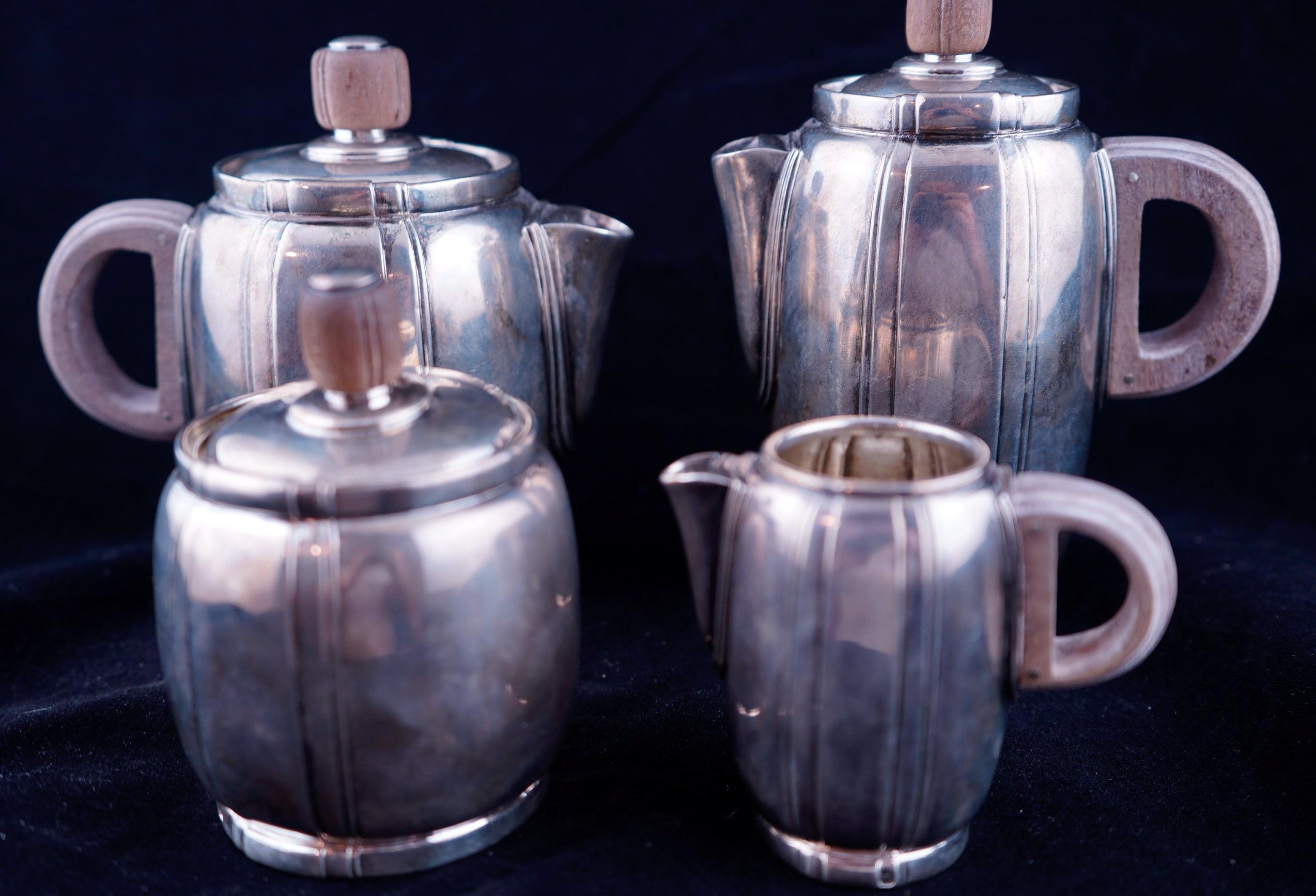 French silver Art Deco tea and coffee service by well known maker Cardeilhac. Each piece is marked with French hallmarks and signed. 
Coffeepot 5 7/8*, teapot 5 1/4