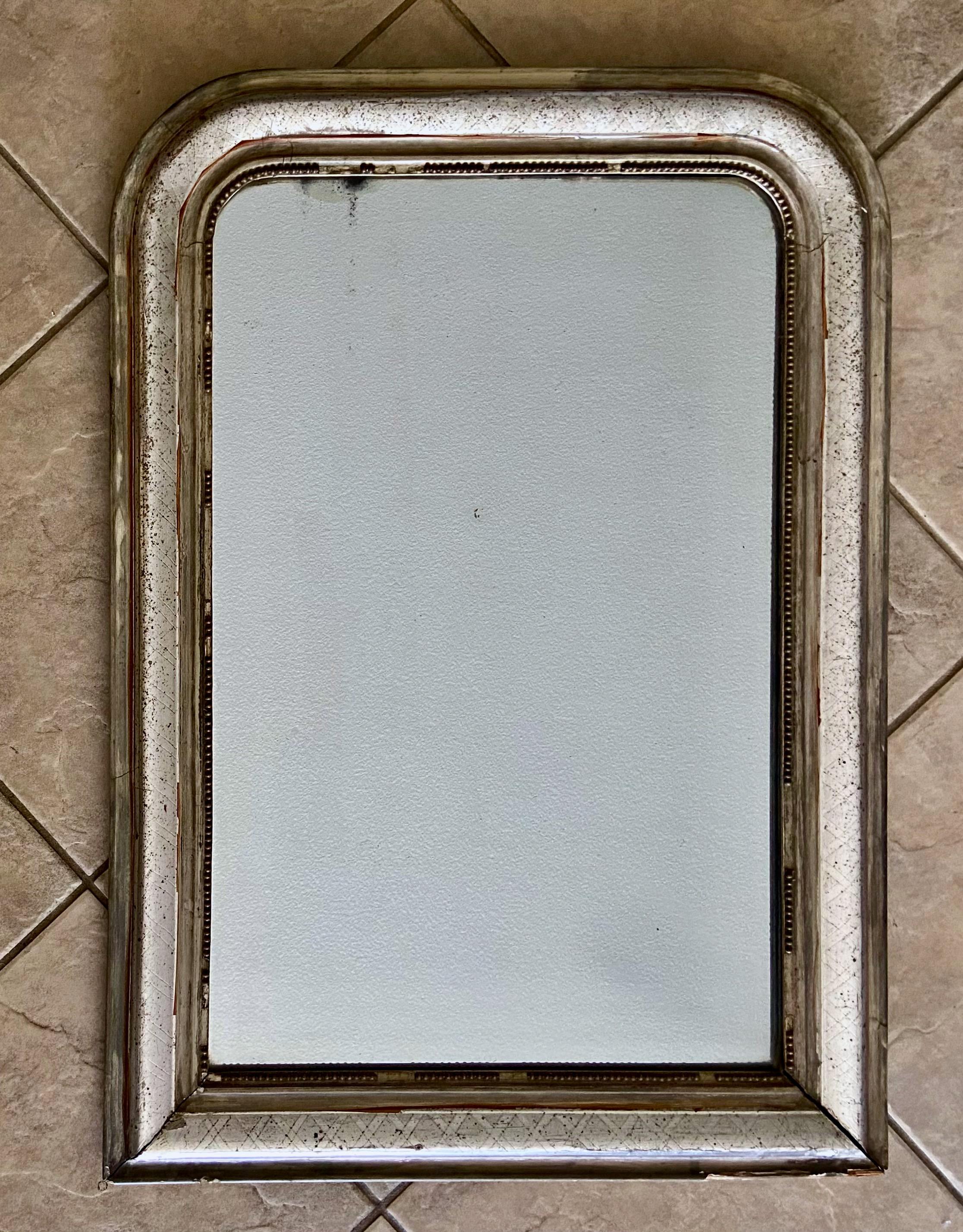 Antique late 19century Louis Philippe silver gilt wall mirror.