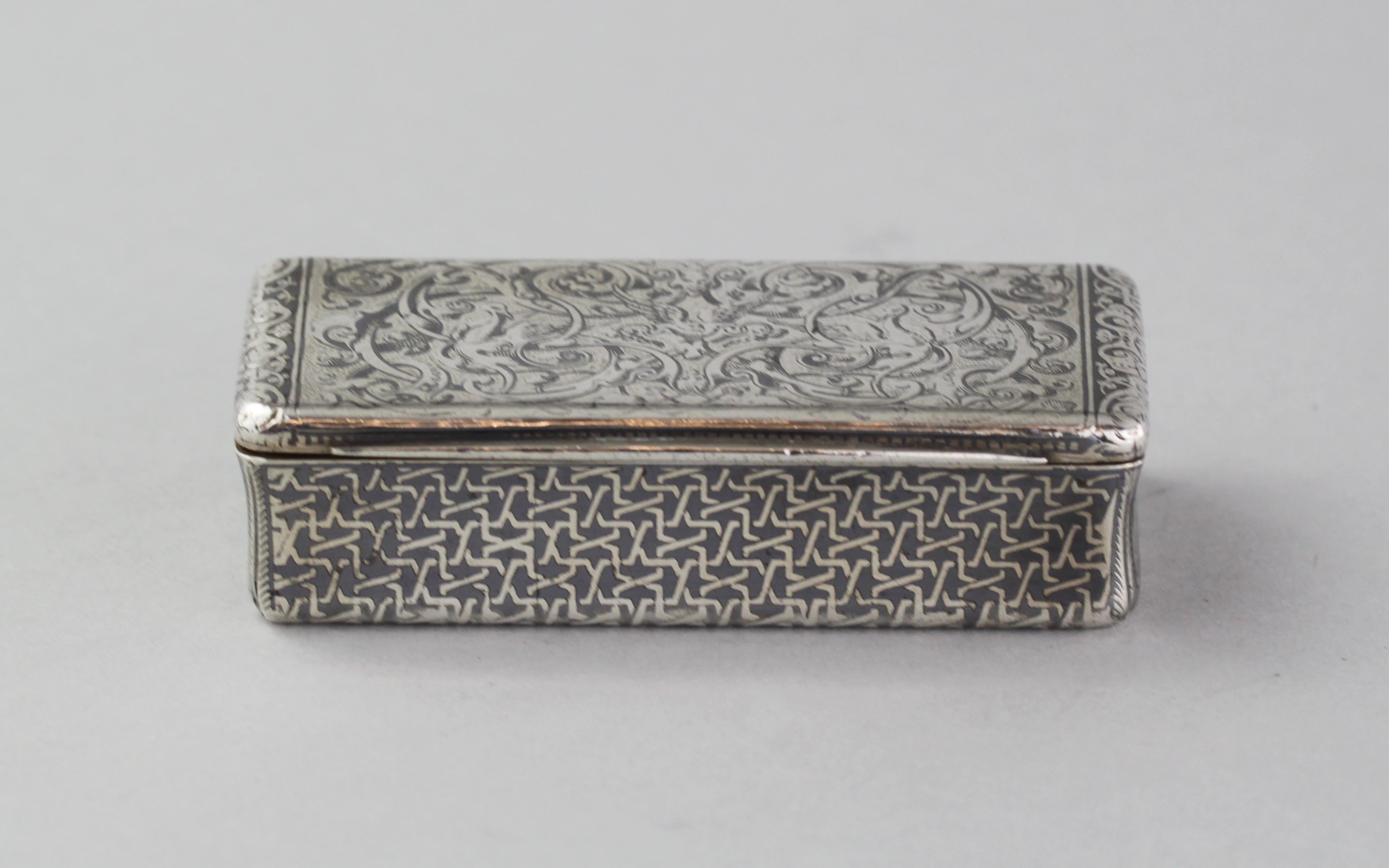 French silver niello snuff box, 19th century

Made in France, circa 1880.

Marked with the Minerva head and number 2 denoting its 800 grade silver, makers mark is partialy rubbed so we can not determine the maker.

Size: 7.8 x 3.3 x 2
