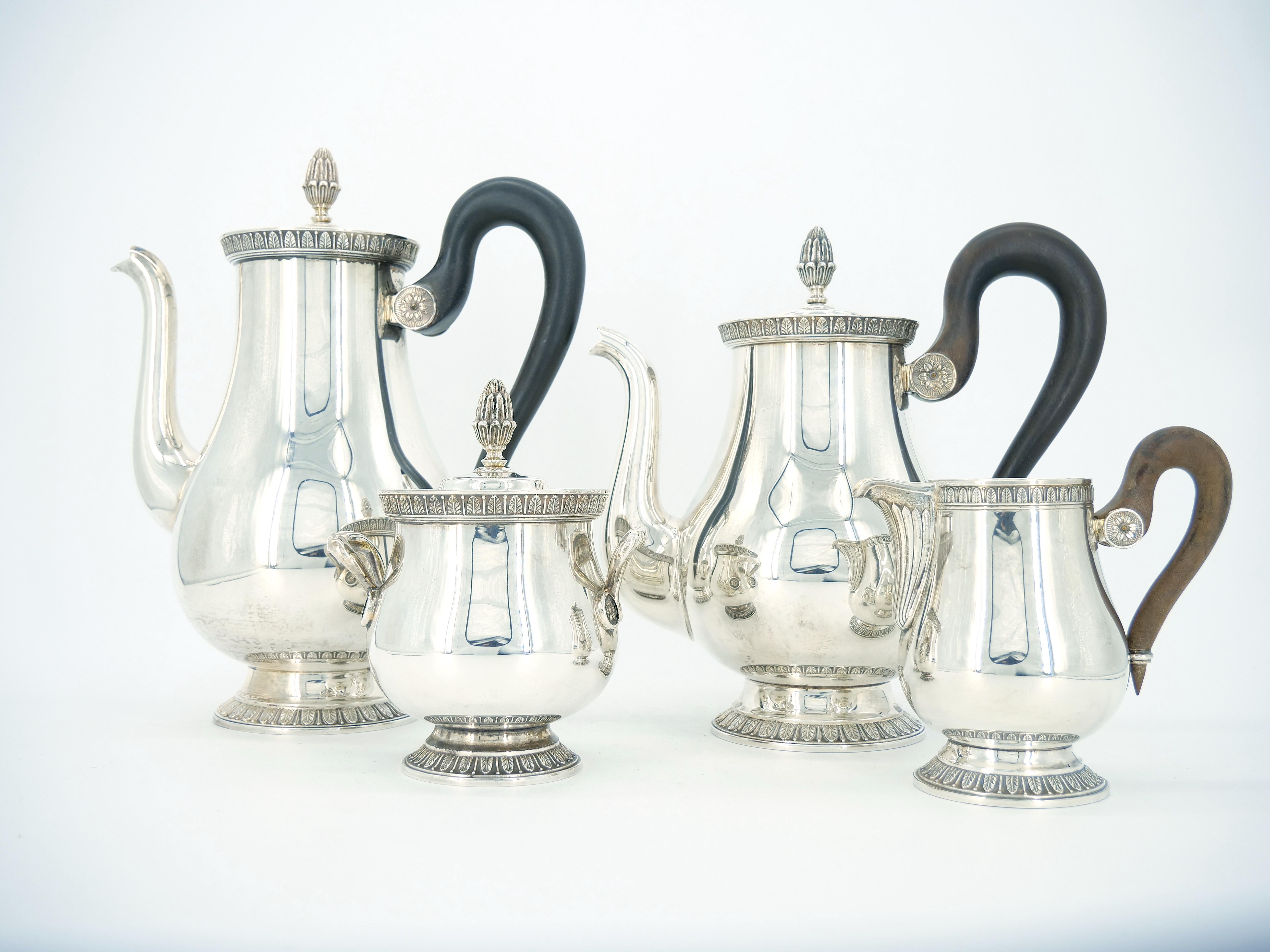 Indulge in the timeless allure of this neoclassical design with this opulent five-piece coffee and tea set meticulously crafted by the esteemed Christofle. This exquisite service, featuring a coffee pot, tea pot, milk jug, sugar bowl, and a