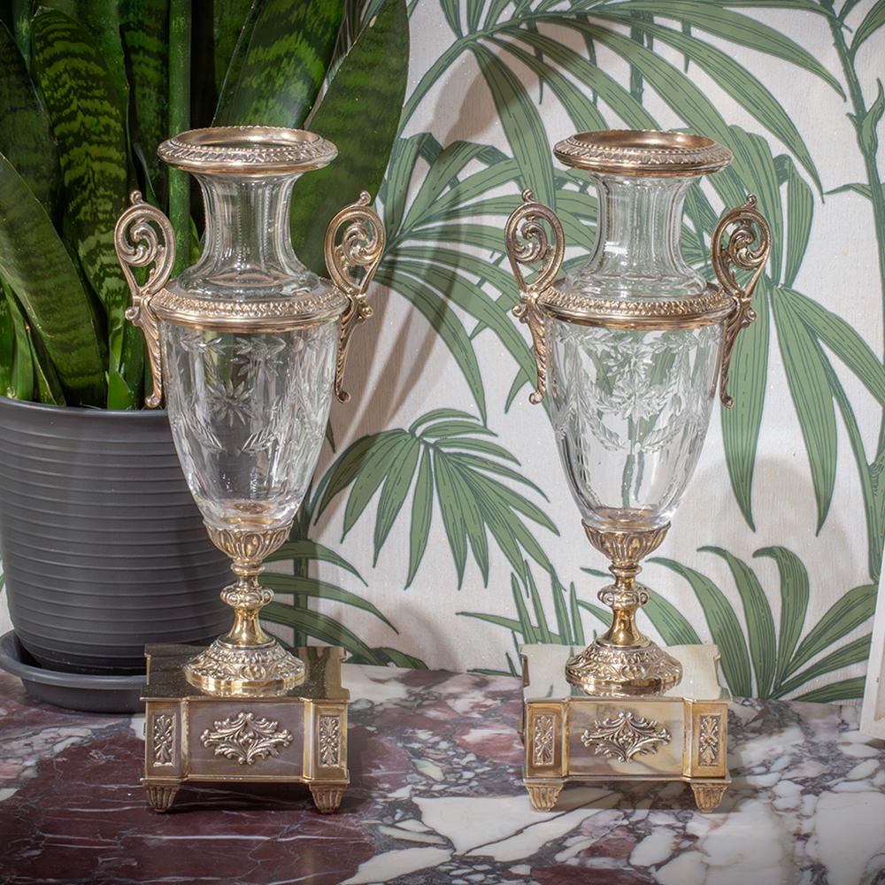 FREE WORLDWIDE SHIPPING ON ALL OUR COLLECTION

From our Vases collection, we are pleased to offer this pair of French Silver Plate and Cut Glass Vases.

Each vase is finely made with a waisted neck and tear-drop body, mounted on square plinth bases