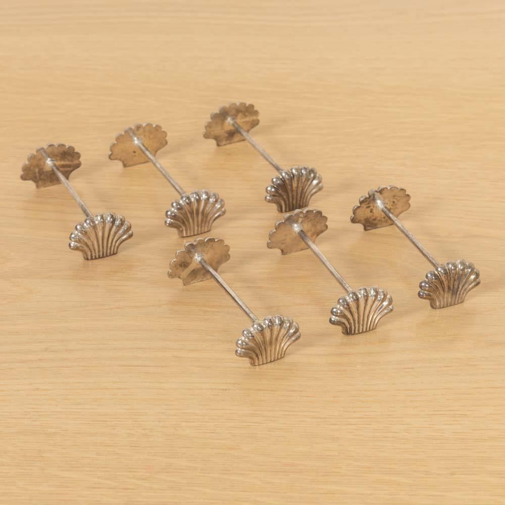Unique set of 6 vintage silver plate shell knife rests from France. Whimsical design and details. Delightful scallop shell motif at each end. Sold as a set of 6. 